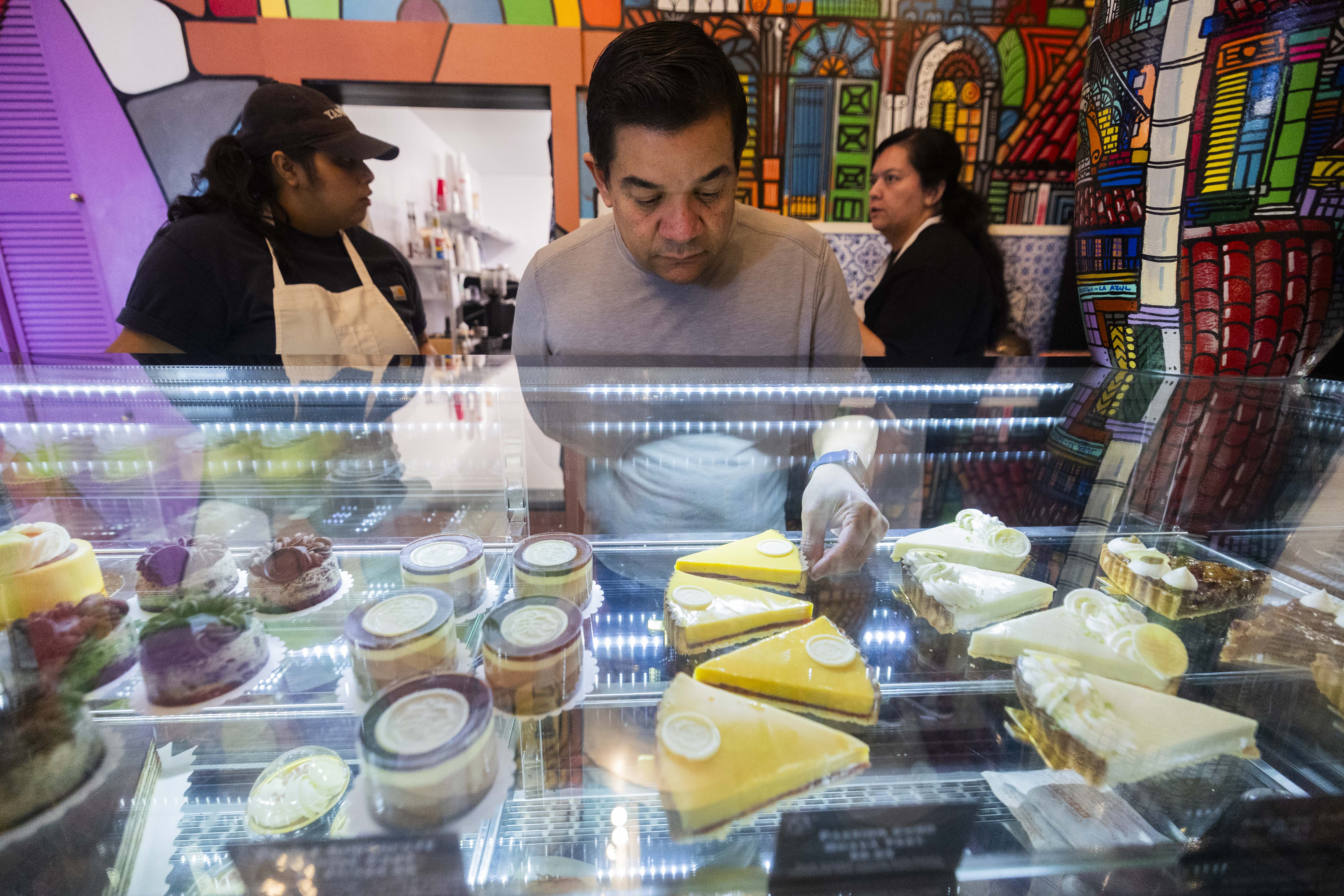 Chef Adalberto Diaz Labrada restocks pies in the front counter of his bakery, Fillings & Emulsions, in Salt Lake City on Wednesday, Feb. 19.