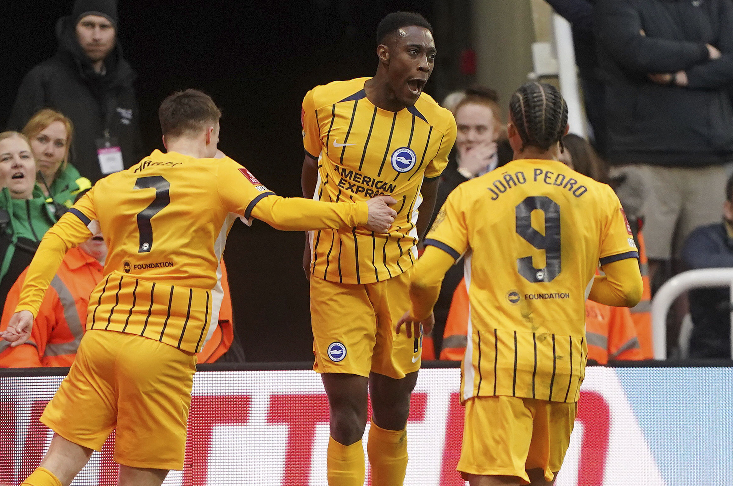 Brighton and Hove Albion's Danny Welbeck, centre, celebrates with teammates after scoring their side's second goal during the FA Cup fifth round match between Newcastle United and Brighton and Hove Albion at St James' Park, Newcastle, England, Sunday, March 2, 2025. 