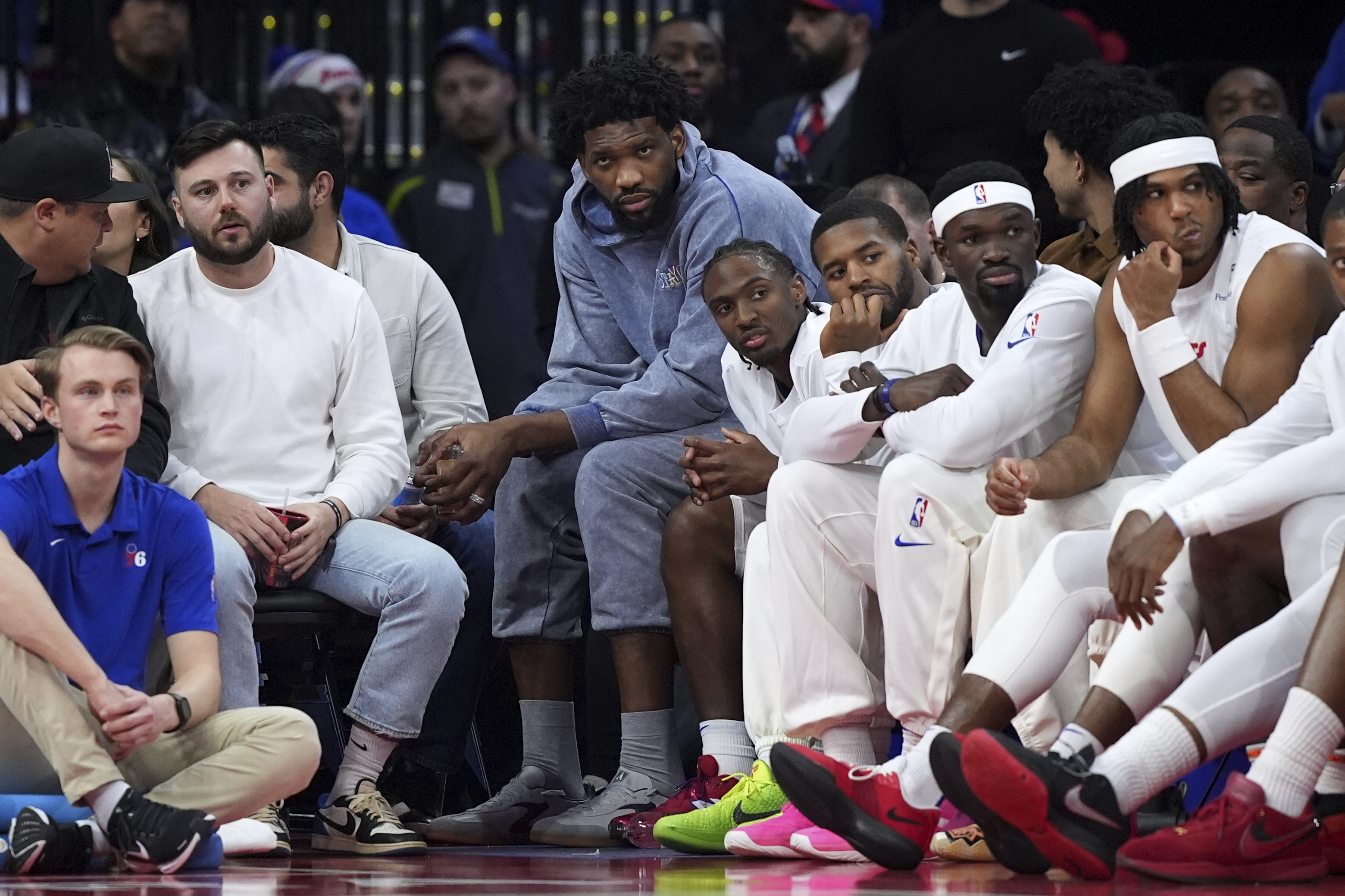 Philadelphia 76ers' Joel Embiid sits on the bench during the second half of an NBA basketball game against the Golden State Warriors Saturday, March 1, 2025, in Philadelphia.