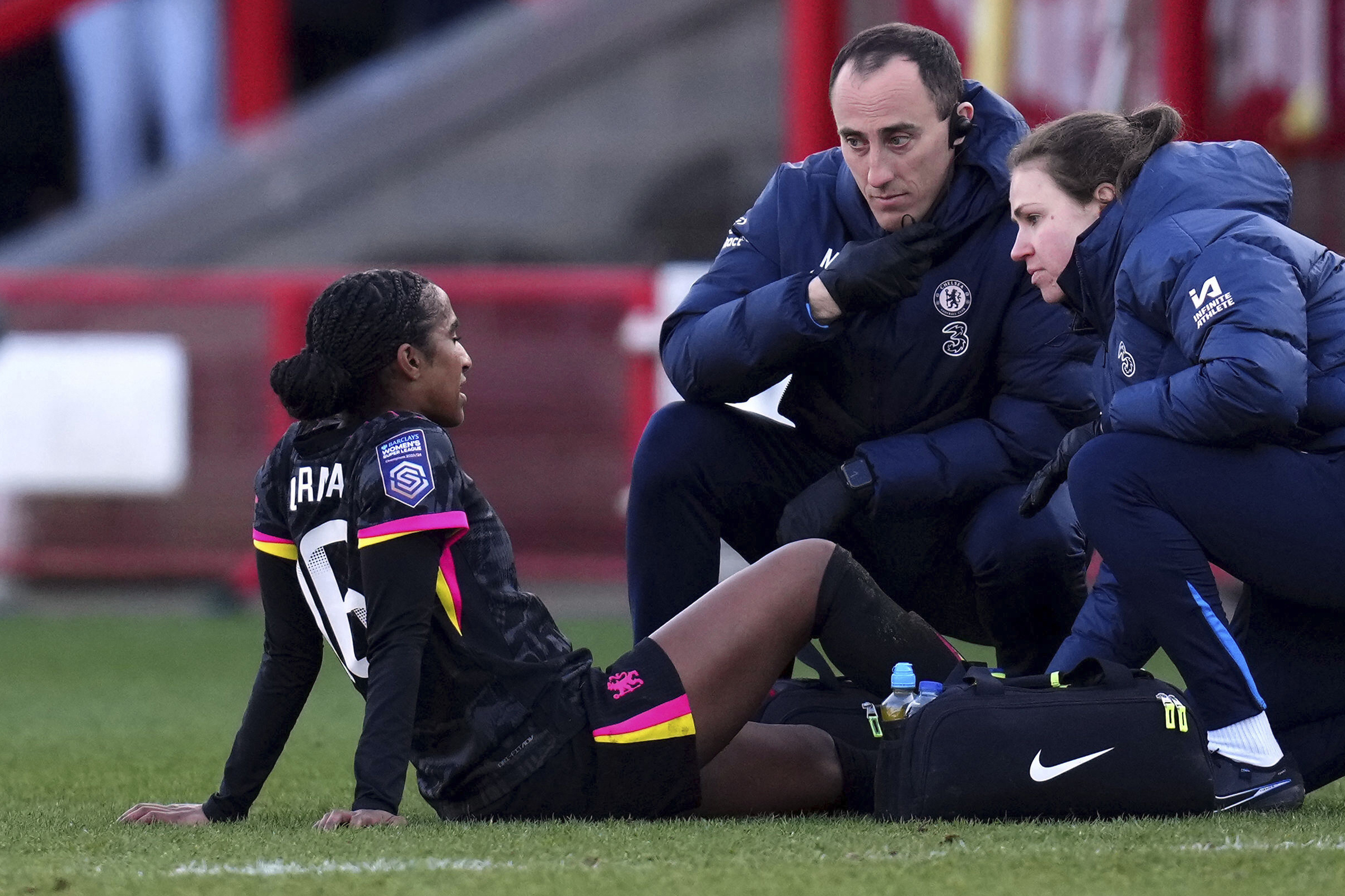 Chelsea's Naomi Girma receives treatment before being substituted during the Barclays Women's Super League match at the Broadfield Stadium, Brighton and Hove, England, Sunday, March 2, 2025. 