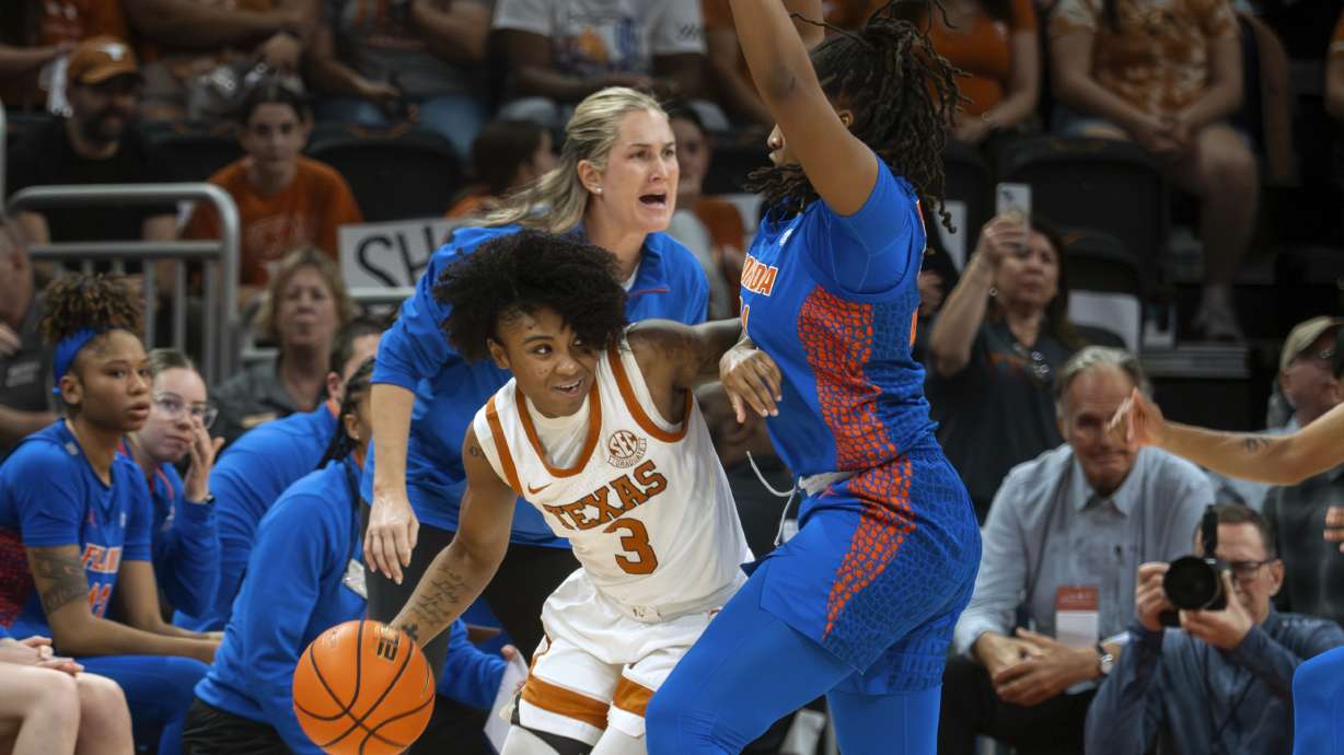 Texas guard Rori Harmon (3) looks to pass the ball against Florida forward Eriny Kindred, right, during the first half an NCAA college basketball game, Sunday, March 2, 2025, in Austin, Texas.