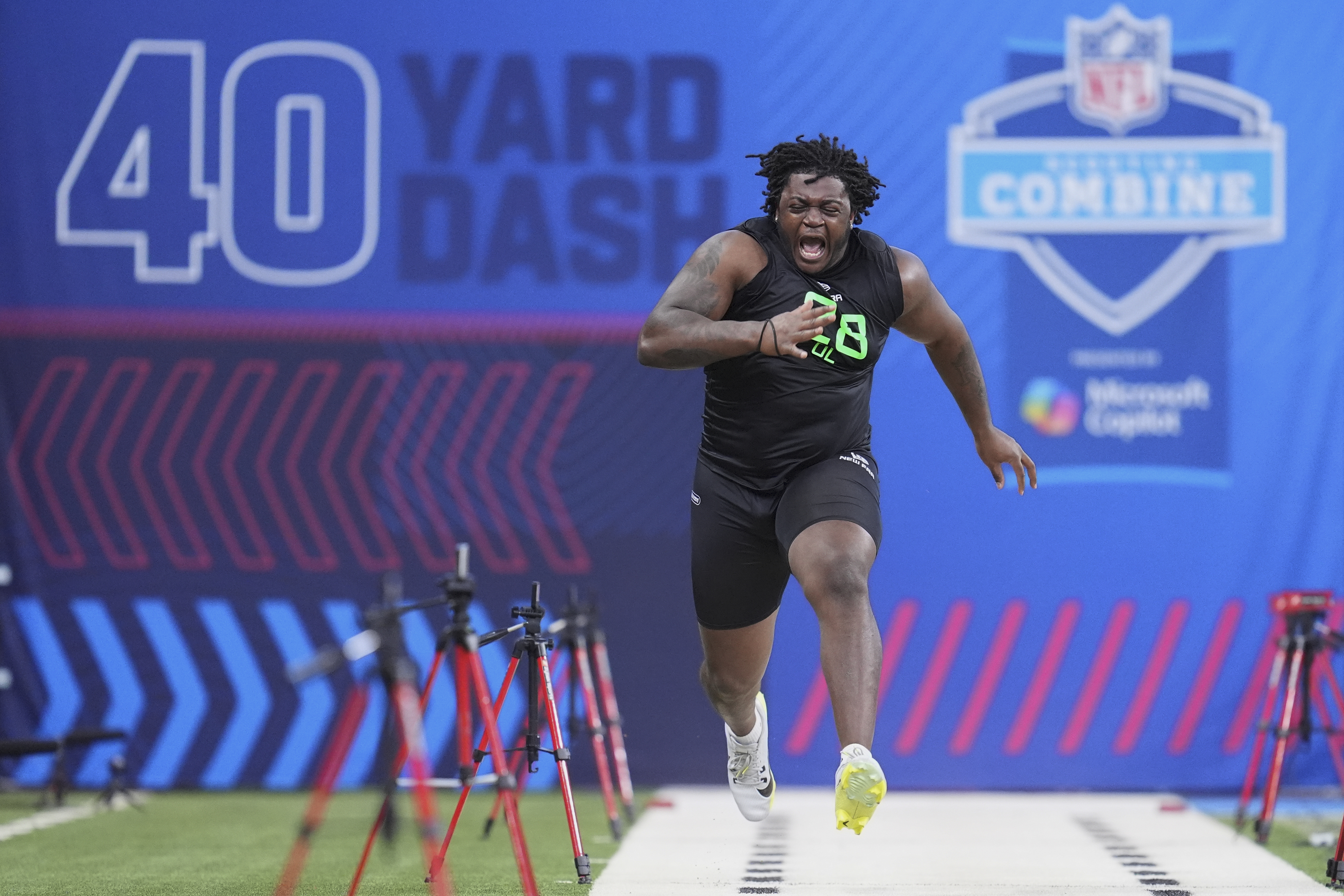 Missouri offensive lineman Armand Membou runs the 40-yard dash at the NFL football scouting combine in Indianapolis, Sunday, March 2, 2025.