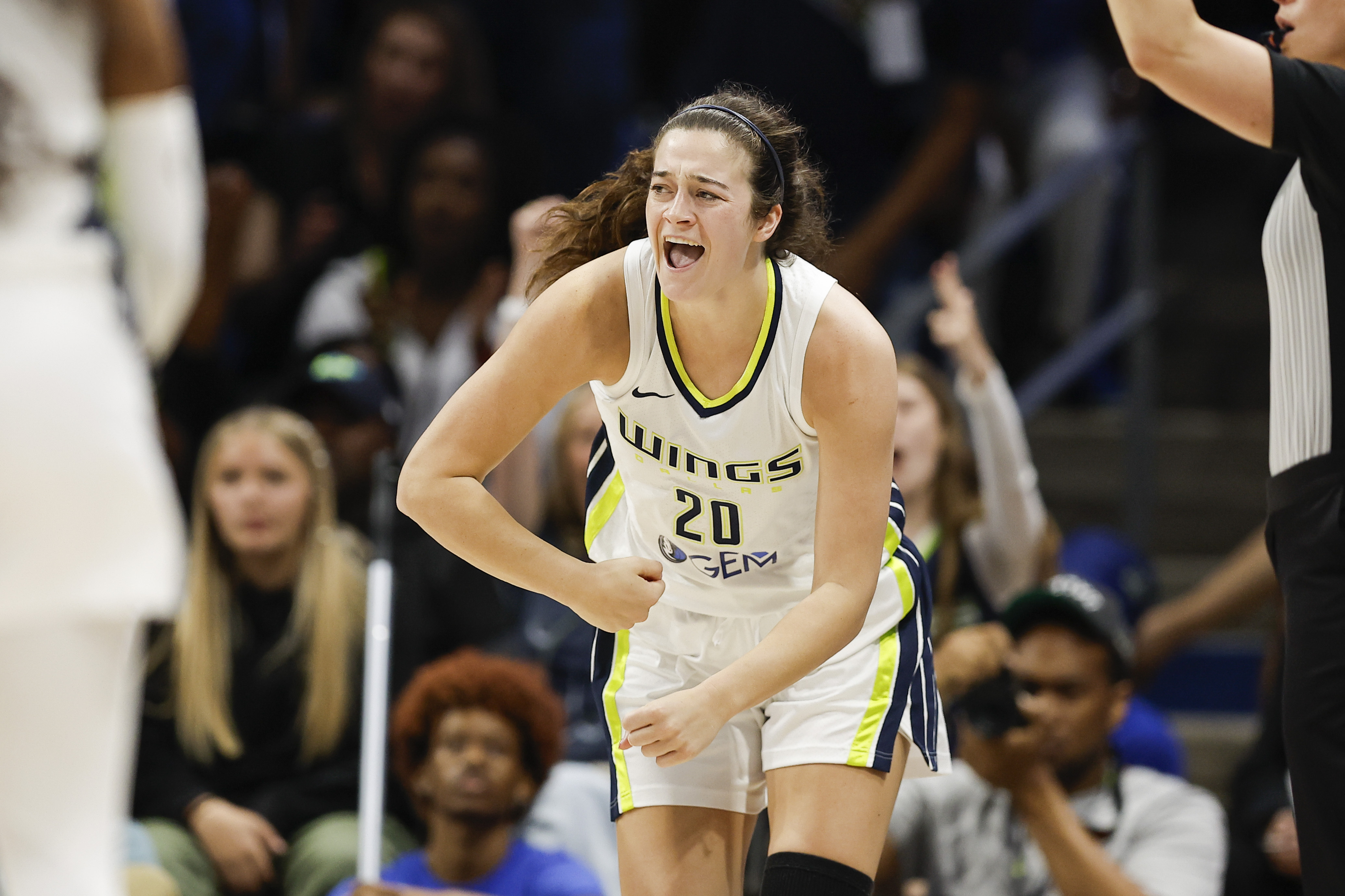 FILE - Dallas Wings forward Maddy Siegrist (20) celebrates a three-point shot during a WNBA basketball game against the Chicago Sky, on May 15, 2024, in Arlington, Texas. 
