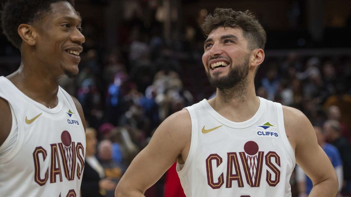 Cleveland Cavaliers' De'Andre Hunter and Ty Jerome are all smiles after an NBA basketball game against the Portland Trail Blazers in Cleveland, Sunday, March 2, 2025.