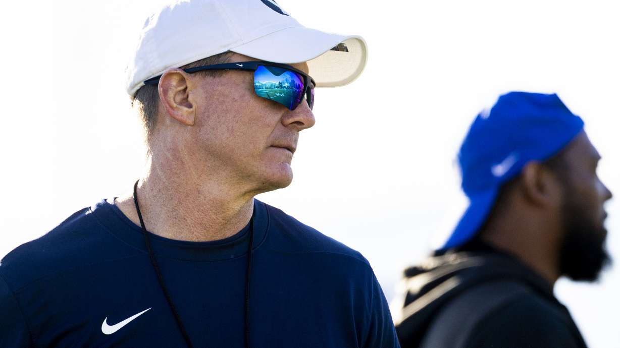 BYU defensive coordinator Jay Hill, left, and cornerbacks coach Jernaro Gilford watch a play unfold during the opening day of BYU football spring camp held at the Zions Bank Practice Fields of the Student Athlete Building on the campus of Brigham Young University in Provo on Thursday, Feb. 27, 2025.