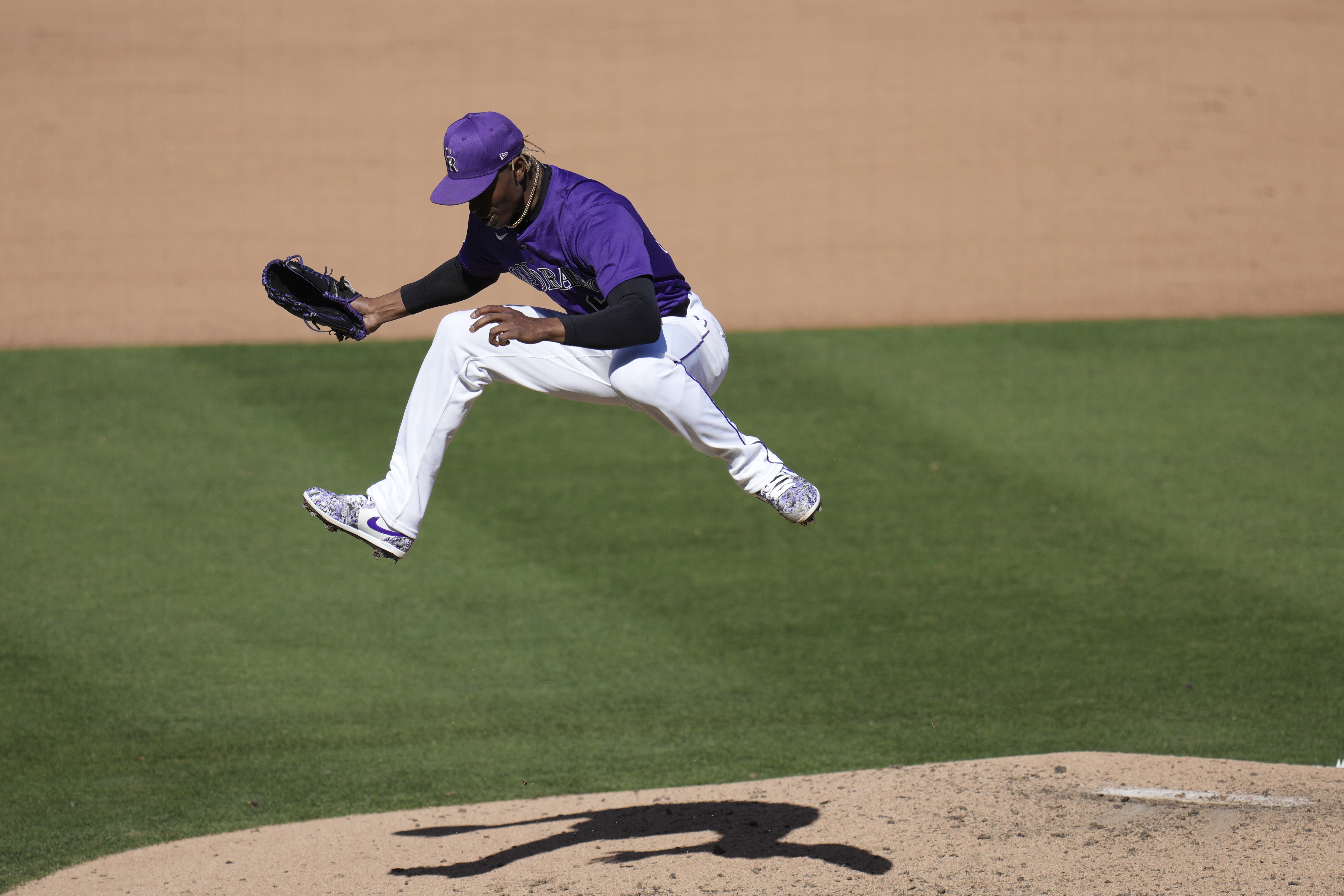 Colorado Rockies pitcher Jefry Yan celebrates a strikeout against Seattle Mariners' Jacob Nottingham during the seventh inning of a spring training baseball game, Sunday, March 2, 2025, in Scottsdale, Ariz. 