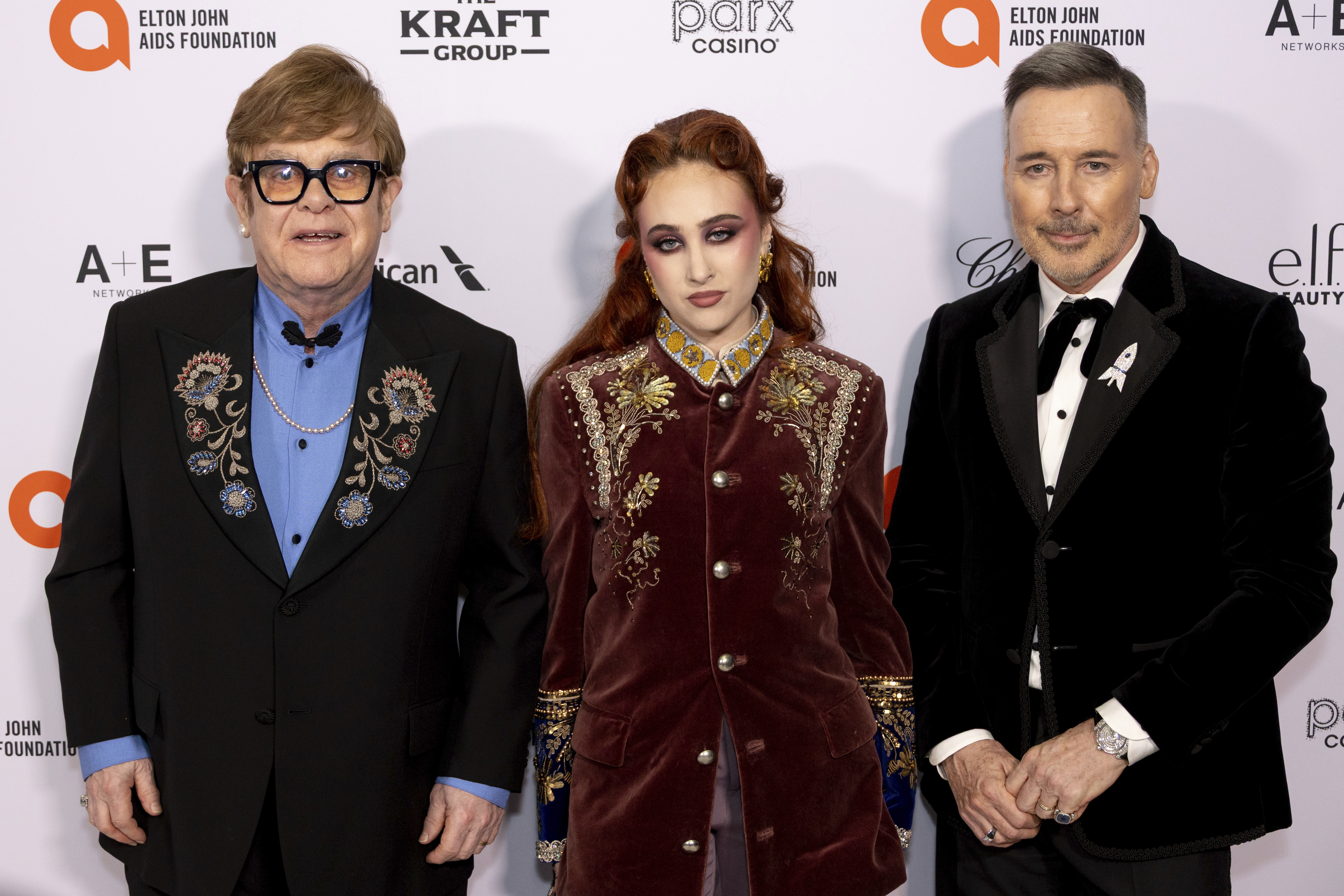 Elton John, Chapell Roan and David Furnish arrive at the 33rd Annual Elton John AIDS Foundation Academy Awards Viewing Party on Sunday, in West Hollywood, Calif.
