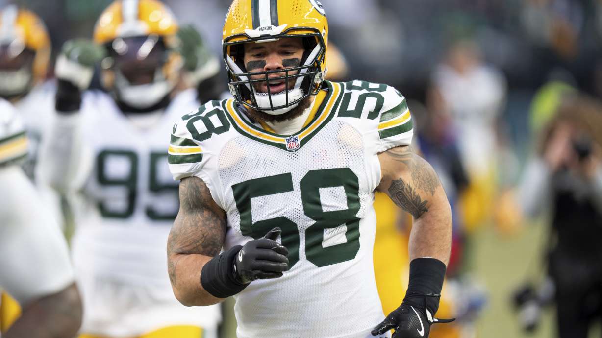 FILE - Green Bay Packers linebacker Isaiah McDuffie (58) goes into the locker room with his team after warm-ups before an NFL wild-card playoff football game against the Philadelphia Eagles, Jan. 12, 2025, in Philadelphia.
