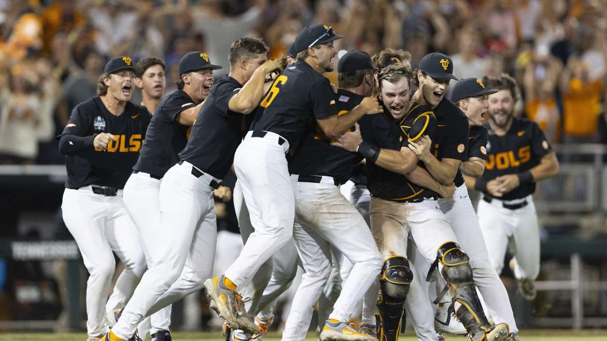FILE - Tennessee players celebrate their 6-5 victory against Texas A&M in Game 3 of the NCAA College World Series baseball finals in Omaha, Neb., June 24, 2024.