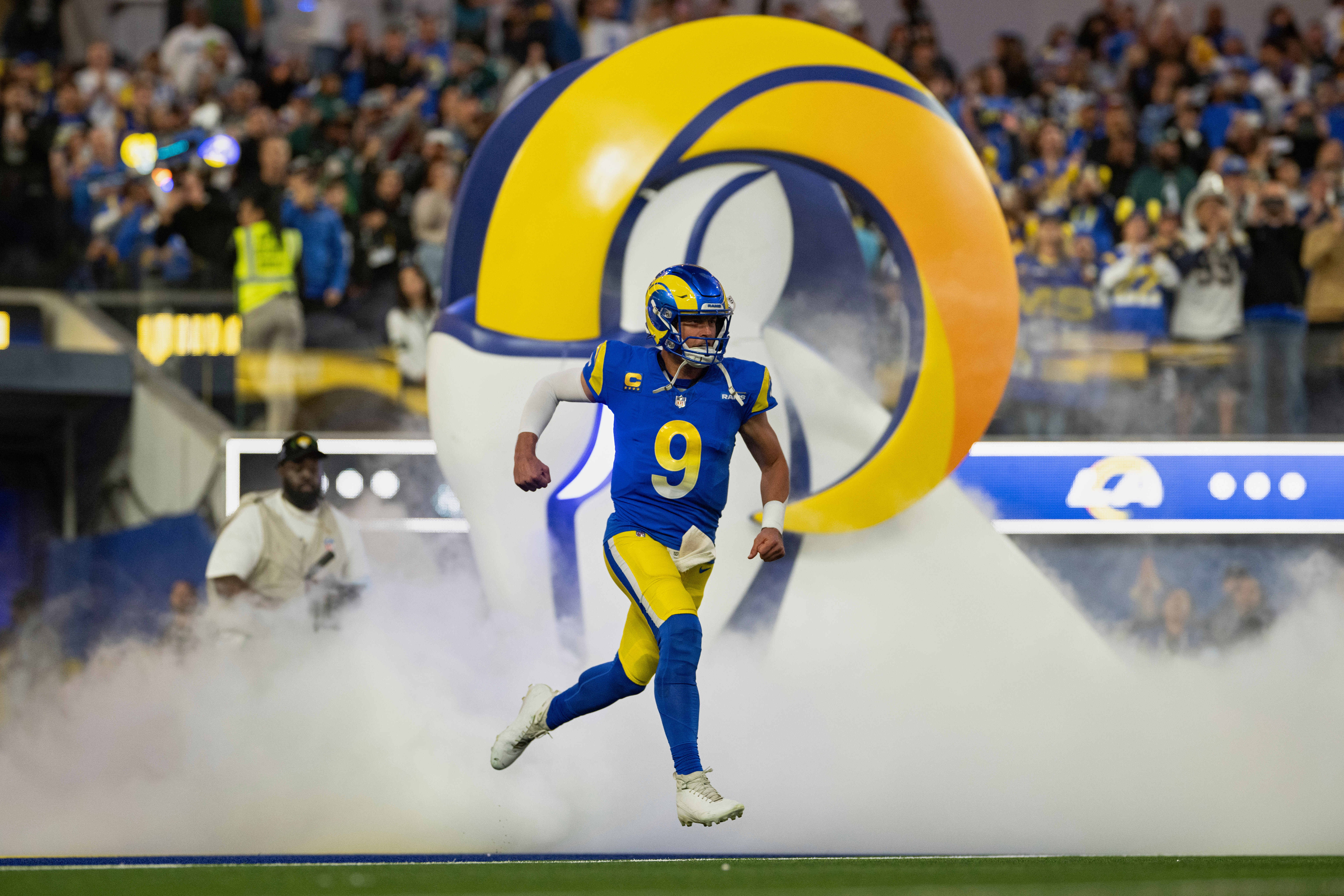 FILE - Los Angeles Rams quarterback Matthew Stafford (9) runs onto the field before an NFL football game against Philadelphia Eagles, Sunday, Nov. 24, 2024, in Inglewood, Calif. 