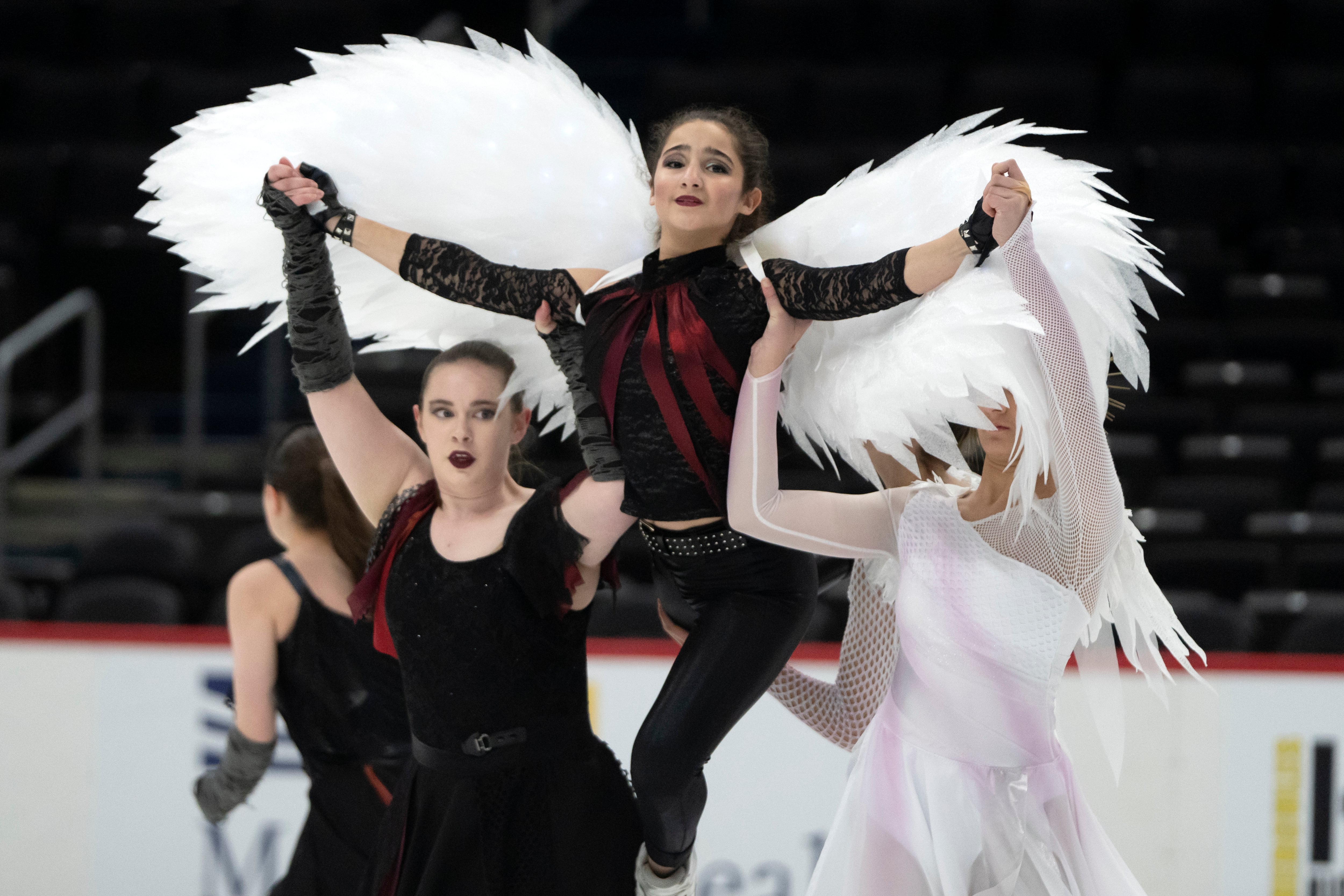 Members of the Capital Theatre on Ice Senior Team perform at Capital One Arena as Washington-area figure skaters gathered in advance of the Legacy on Ice skating event Sunday, organized to honor figure skaters and coaches who died in the recent plane crash, on Feb. 17 in Washington.