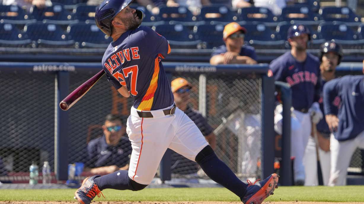 Houston Astros' Jose Altuve flies out during the third inning of a spring training baseball game against the St. Louis Cardinals Friday, Feb. 28, 2025, in West Palm Beach, Fla.