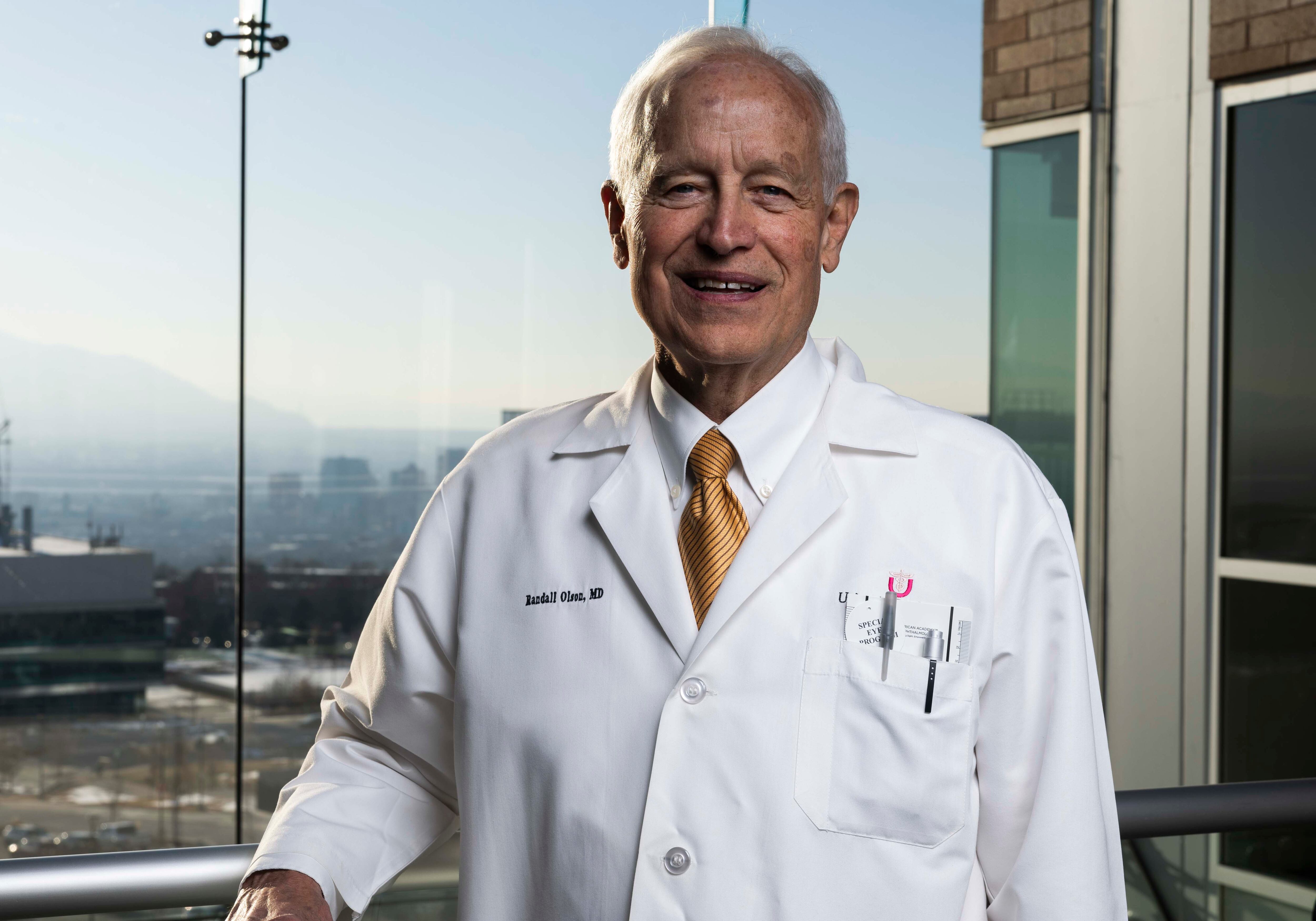 Dr. Randall J Olson, one of the founders of the Moran Eye Center, poses for a photo in a lobby at the Moran Eye Center in Salt Lake City on Jan. 27.