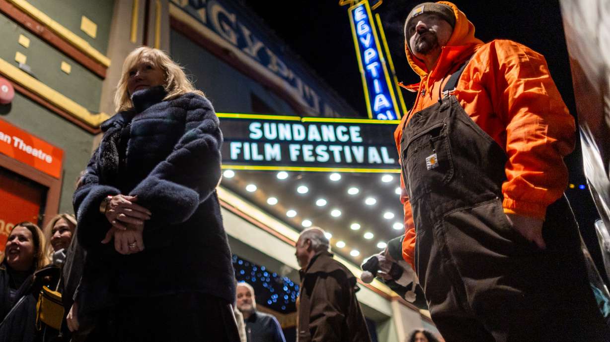 People stand outside the Egyptian Theatre at the Sundance Film Festival in Park City on Jan. 24. Next year's festival will begin on Jan. 22, 2026, marking its time in Utah.