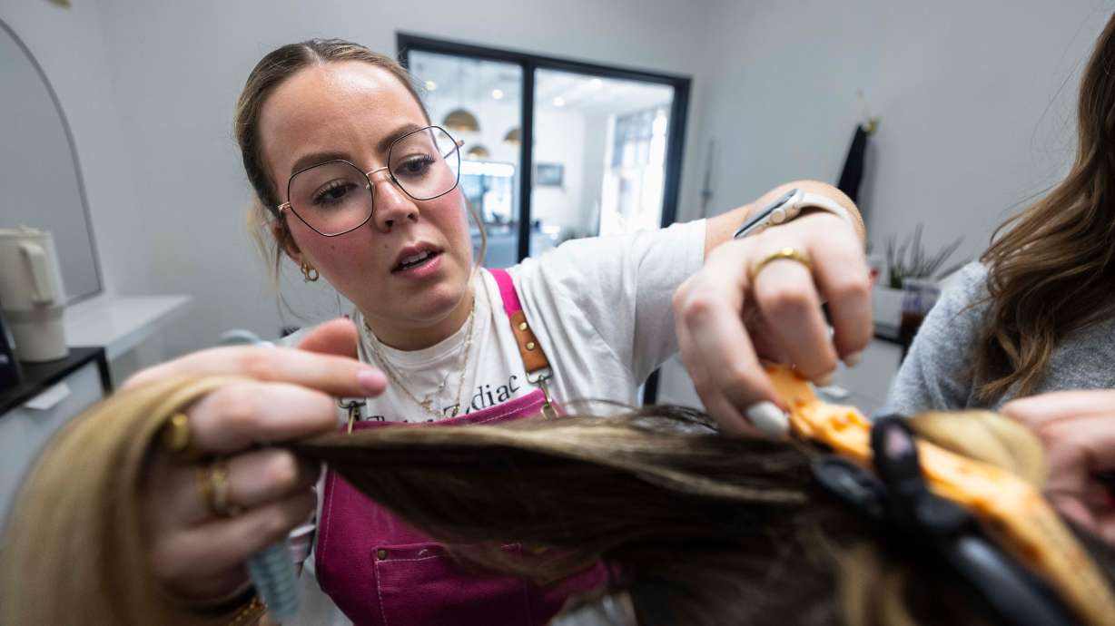 Hair design apprentice Melanie Wheeler works on giving a client highlights at Shade Nine Salon in American Fork on Feb. 27. A bill in the state Legislature would make changes to licensing for estheticians, hair stylists, nail techs, barbers and others.