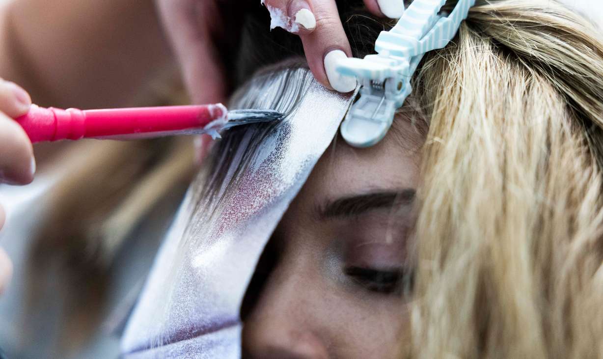Hair design apprentice Melanie Wheeler works on giving her client Sarah Porter highlights at Shade Nine Salon in American Fork on Feb. 27.