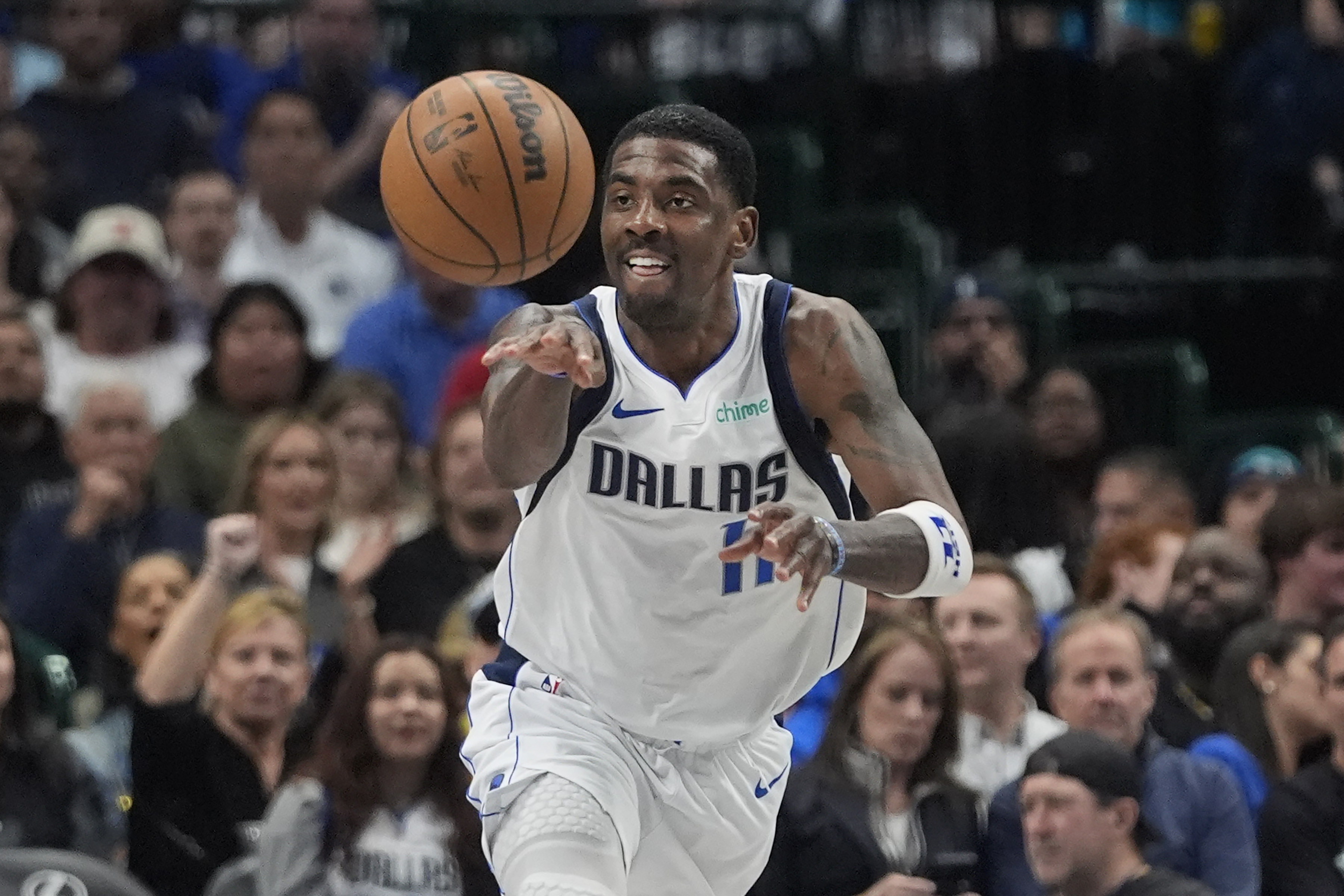 Dallas Mavericks guard Kyrie Irving passes off the ball during the first half of an NBA basketball game against the Charlotte Hornets in Dallas, Thursday, Feb. 27, 2025. 