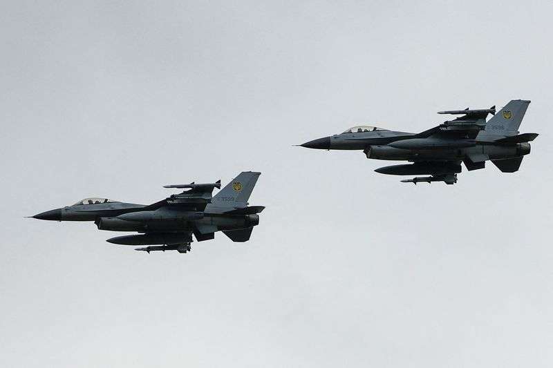 Ukrainian F-16 fighting aircrafts are seen in the air during marking the Day of the Ukrainian Air Forces, amid Russia's attack on Ukraine, in an undisclosed location, Ukraine Aug. 4, 2024.