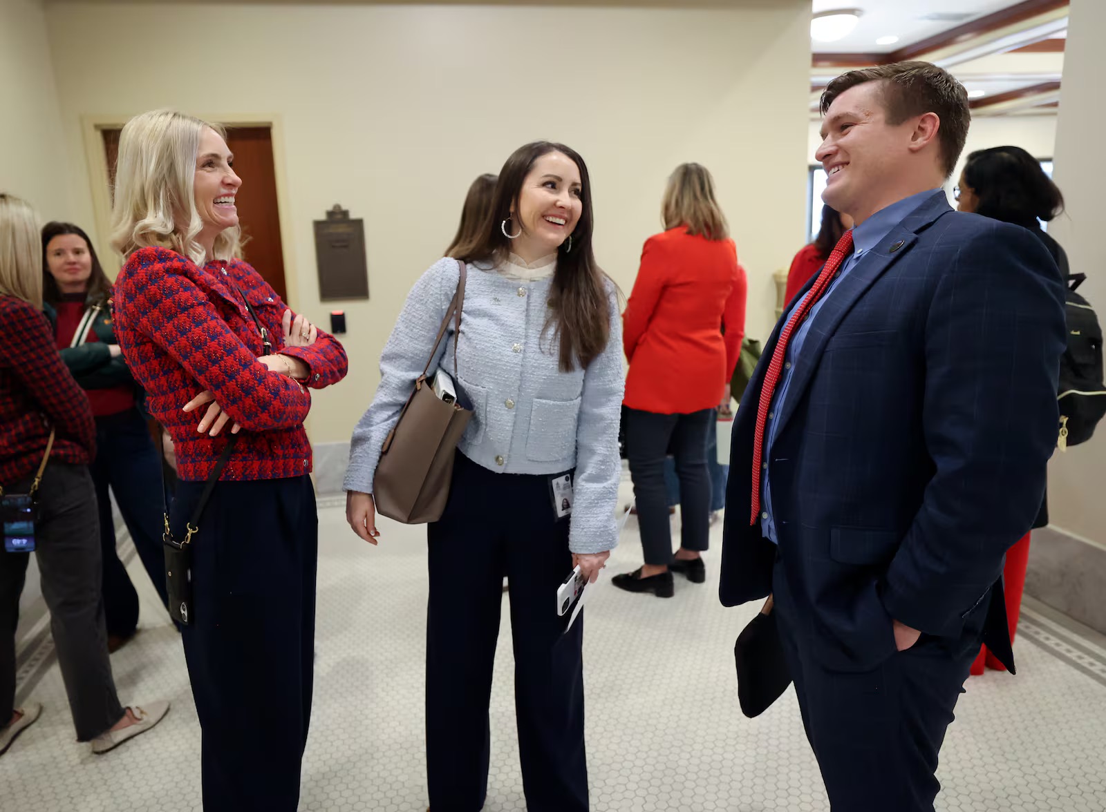 From left, Emily Bell McCormick, The Policy Project president, Rep. Ariel Defay, R-Kaysville, and Rep. Tyler Clancy, R-Provo, talk after Clancy presented HB100 Food Security Amendments in a Senate Education Committee meeting in the Senate Building in Salt Lake City on Monday. HB100 passed the committee meeting.