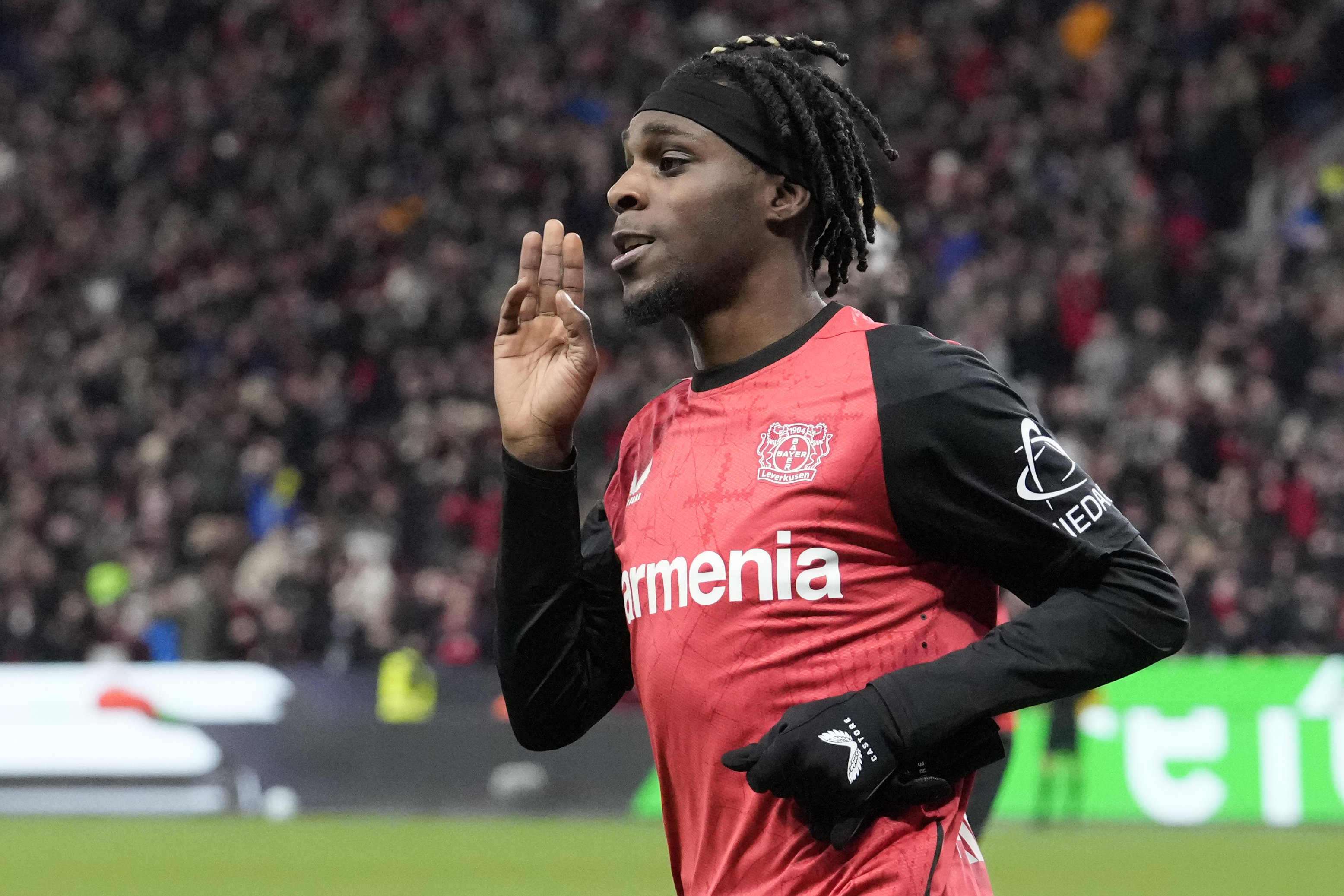 Leverkusen's Jeremie Frimpong celebrates after he scored his side's second goal during the German Bundesliga soccer match between Bayer Leverkusen and TSG Hoffenheim at the BayArena in Leverkusen, Germany, Sunday, Feb. 2, 2025. 