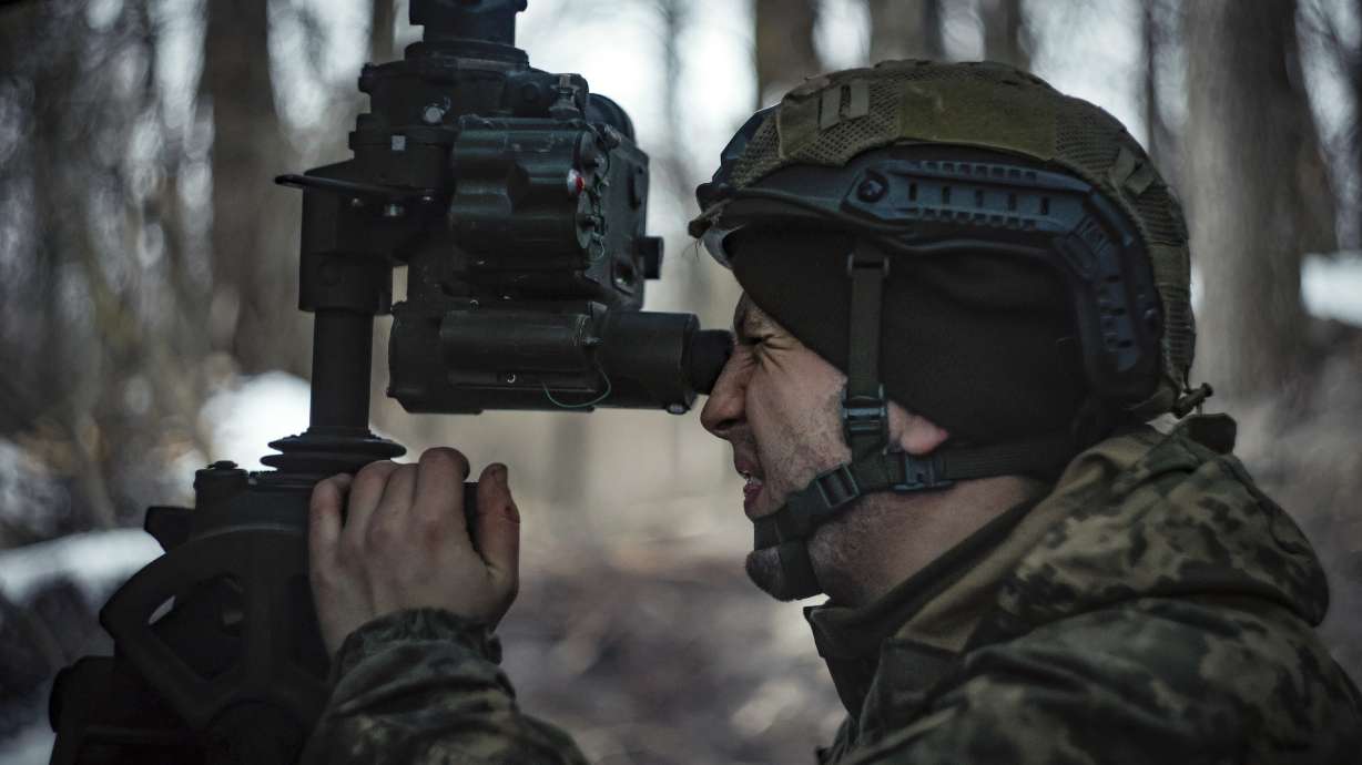 A Ukrainian serviceman prepares to fire a M777 howitzer towards Russian positions at the frontline near Donetsk, Ukraine, Monday. The White House national security adviser said Wednesday that President Trump will consider restoring aid to Ukraine if peace talks are arranged and confidence-building measures are taken.