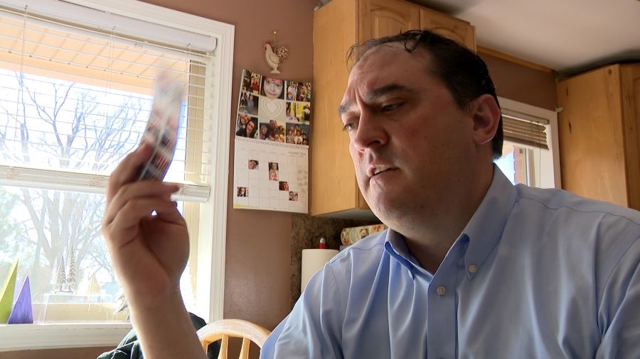 Matt Gephardt, KSL-TV, examines stamps purchased online at a discount.