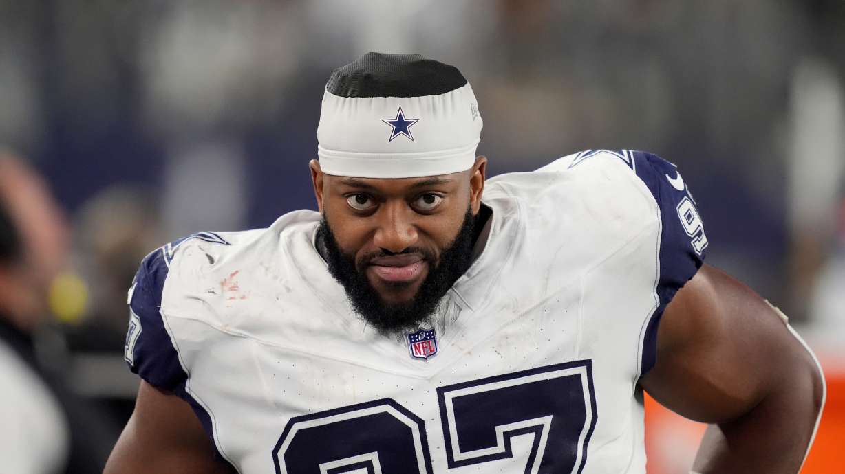 Dallas Cowboys defensive tackle Osa Odighizuwa walks along the sideline during an NFL football game against the Cincinnati Bengals in Arlington, Texas, Monday, Dec. 9, 2024.