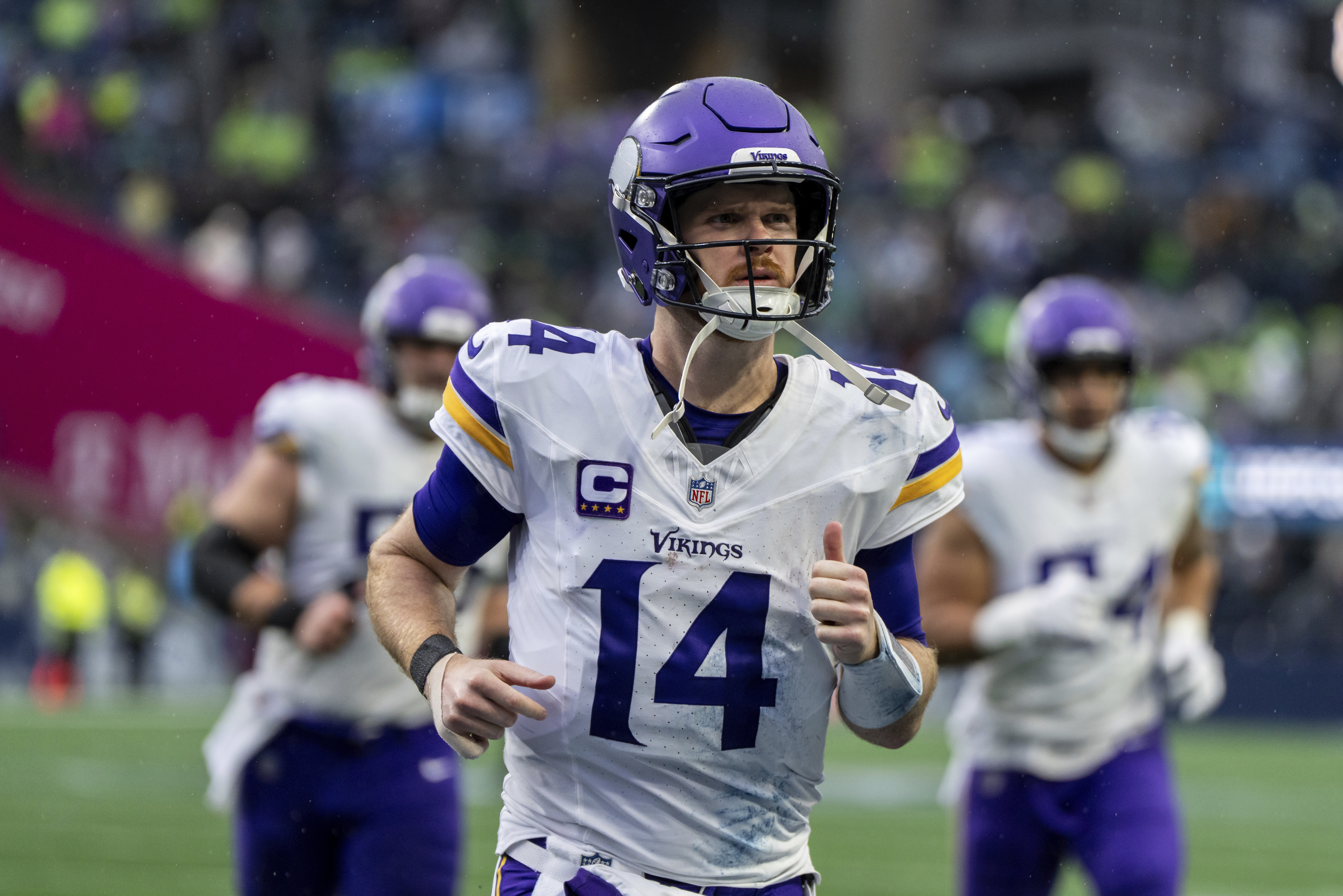 FILE - Minnesota Vikings quarterback Sam Darnold jogs off the field during an NFL football game against the Seattle Seahawks, Sunday, Dec. 22, 2024, in Seattle. 