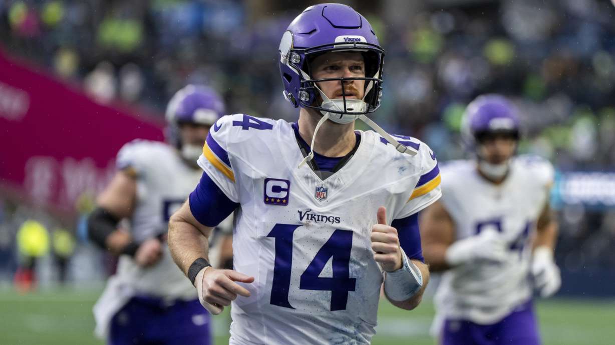 FILE - Minnesota Vikings quarterback Sam Darnold jogs off the field during an NFL football game against the Seattle Seahawks, Sunday, Dec. 22, 2024, in Seattle.