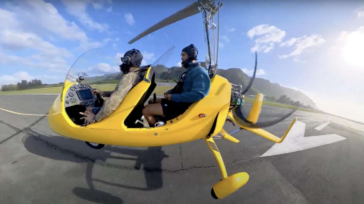 YouTube travel vlogger Jackson Groves prepares to ride along with Skyland Air's Jay Eisenberg on a gyrocopter above Oahu's North Shore.