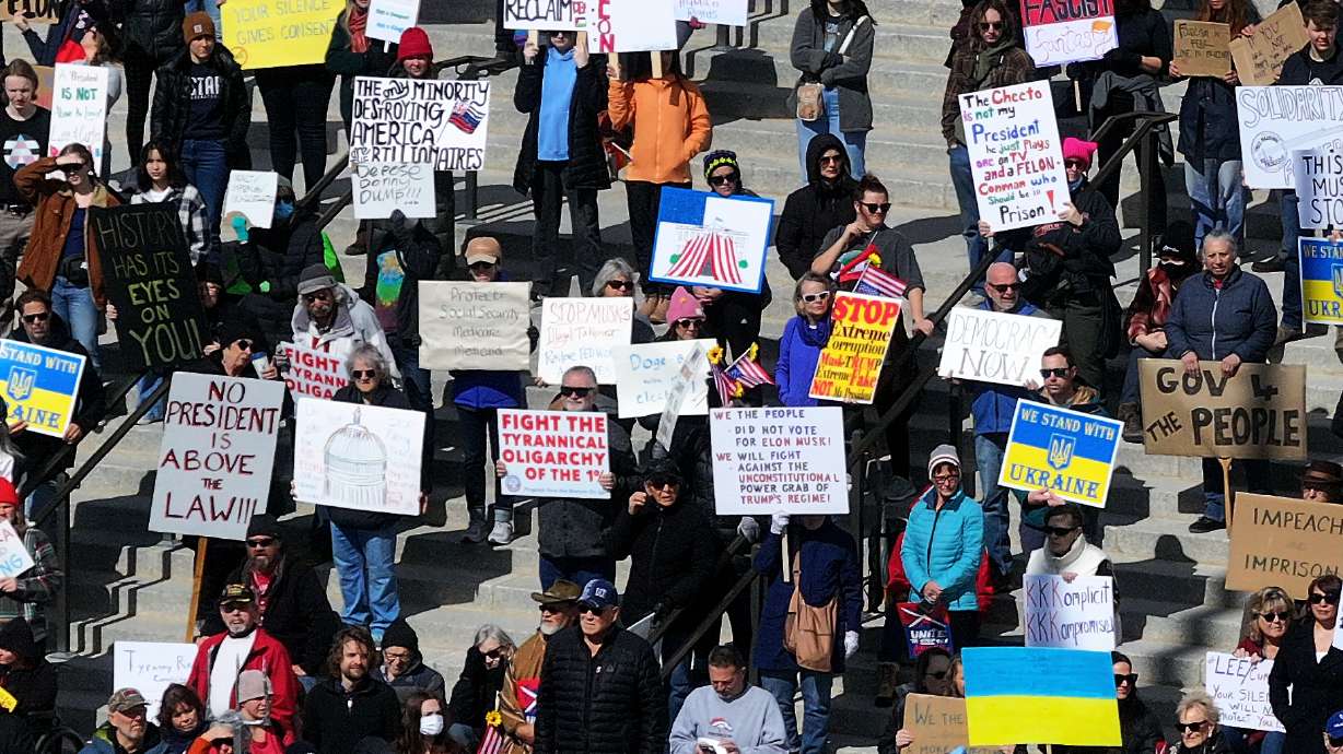 Protesters attend the March 4 Democracy at the Capitol in Salt Lake City on Tuesday. A man was arrested during the rally and accused of trying to spray paint graffiti on the state Capitol.