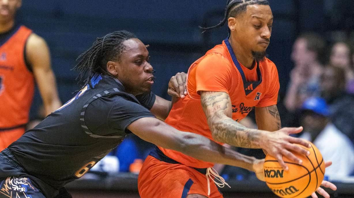 Memphis guard Baraka Okojie (6), left, tries to reach in for the steal against UTSA guard Primo Spears (1) during the first half of an NCAA college basketball game in San Antonio, Texas, Tuesday, March 4, 2025.