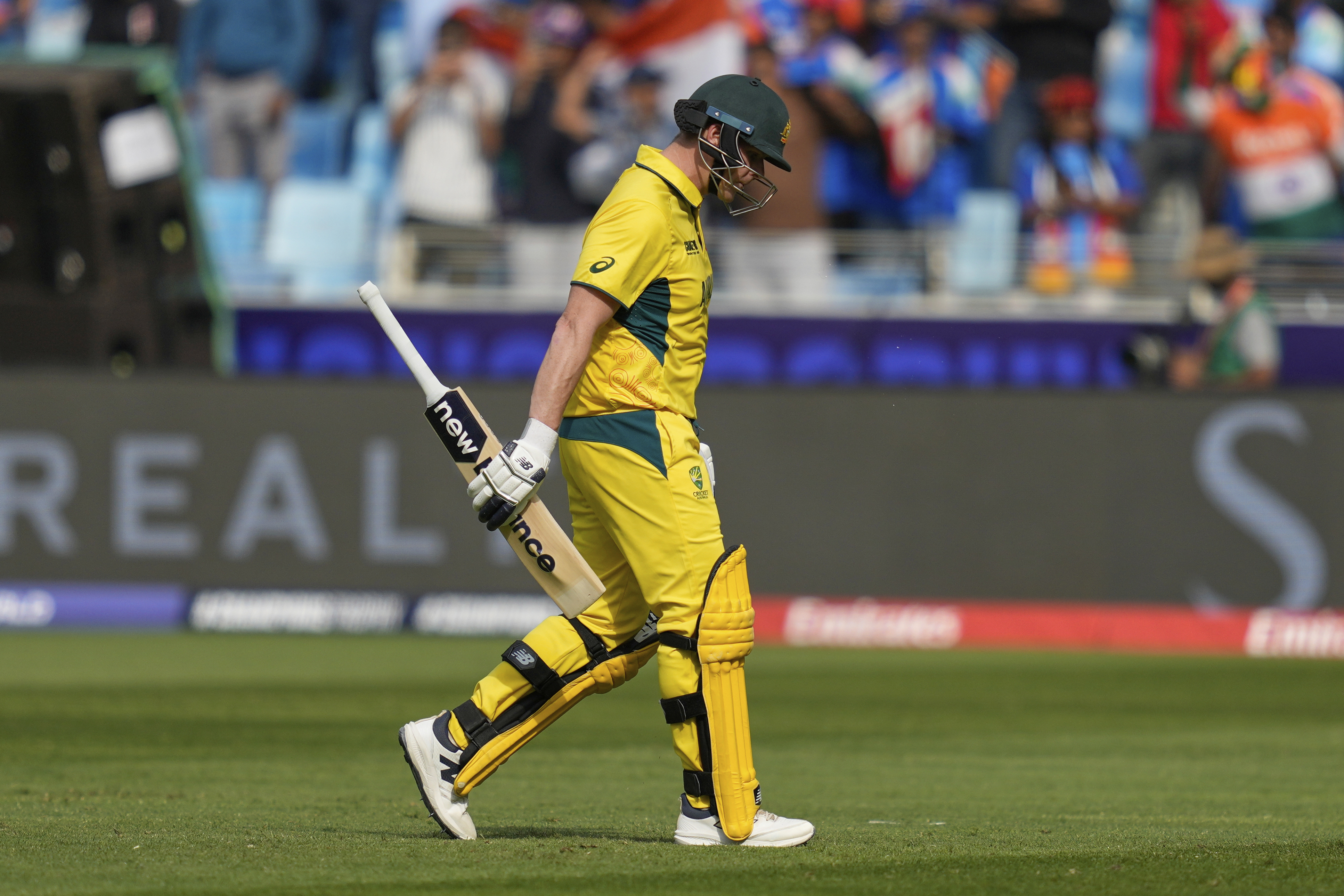 Australia's captain Steve Smith walks off the field after losing his wicket during the ICC Champions Trophy semifinal cricket match between India and Australia at Dubai International Cricket Stadium in Dubai, United Arab Emirates, Tuesday, March 4, 2025. 