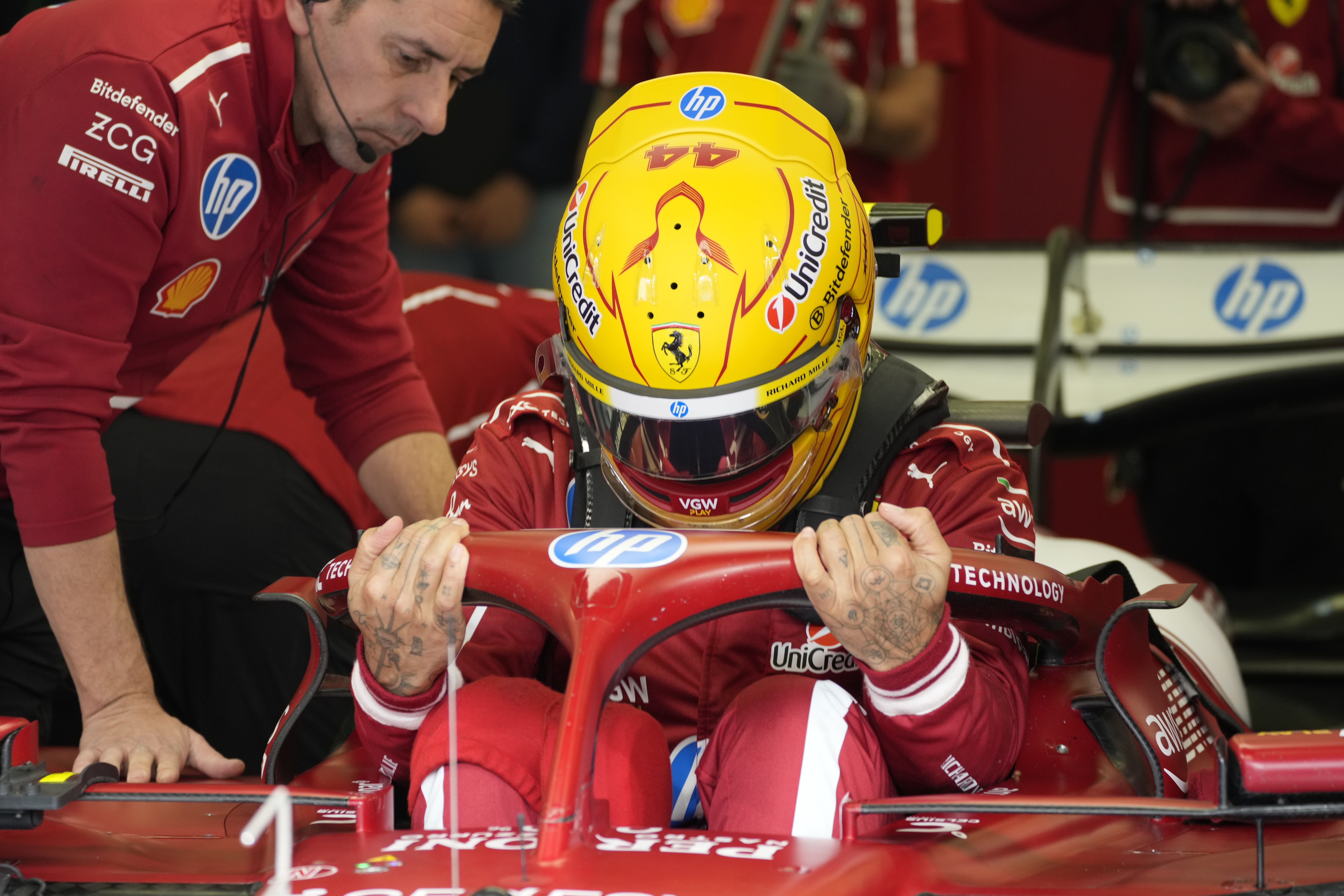 Ferrari driver Lewis Hamilton of Britain gets ready during a Formula One pre-season test at the Bahrain International Circuit in Sakhir, Bahrain, Friday, Feb. 28, 2025.