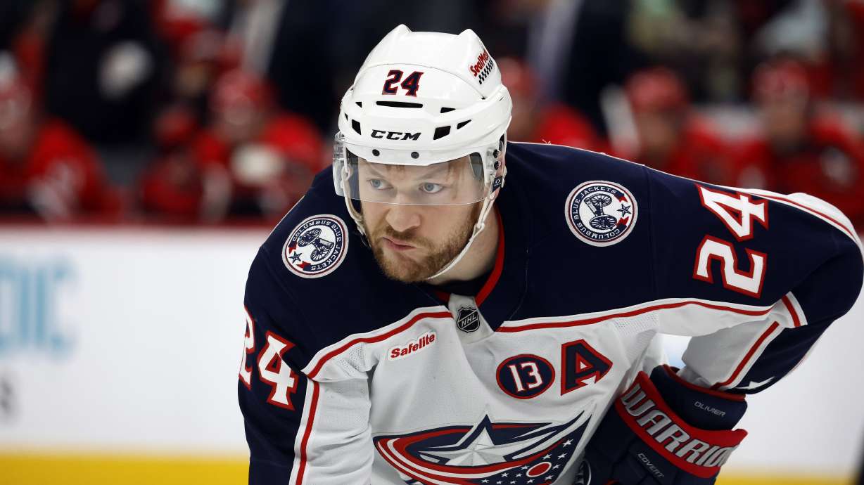 FILE -Columbus Blue Jackets' Mathieu Olivier (24) waits for a face-off against the Carolina Hurricanes during the first period of an NHL hockey game in Raleigh, N.C., Thursday, Jan. 23, 2025.