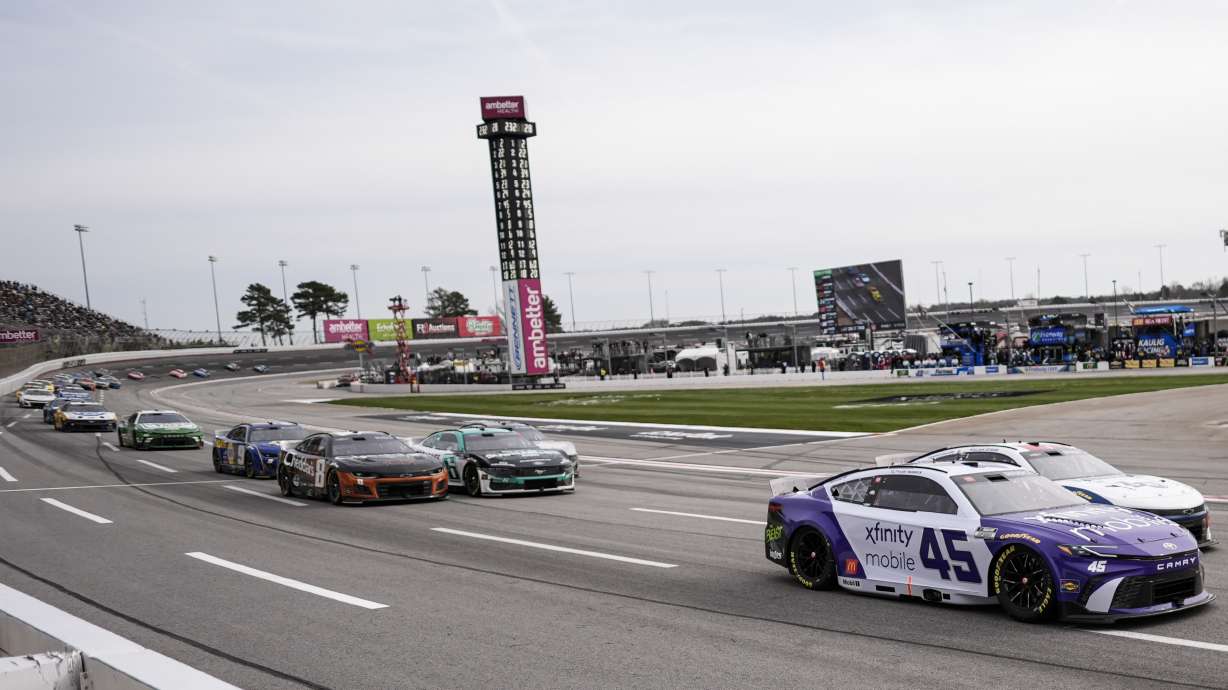 Tyler Reddick (45) pulls out of Turn 4 during a NASCAR Cup Series auto race, Sunday, Feb. 23, 2025, in Hampton, Ga.