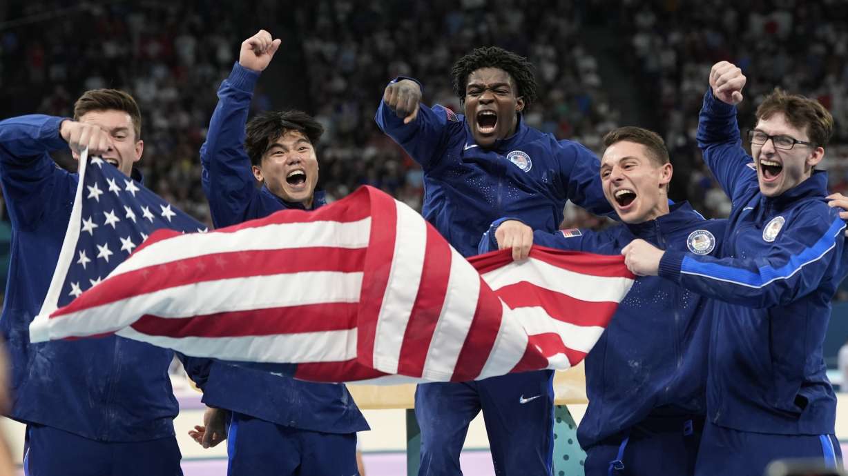 FILE - Team USA from left to right Brody Malone, Asher Hong, Fred Richard, Paul Juda and Stephen Nedoroscik celebrate their bronze medal during the men's artistic gymnastics team finals round at Bercy Arena at the 2024 Summer Olympics, July 29, 2024, in Paris, France.
