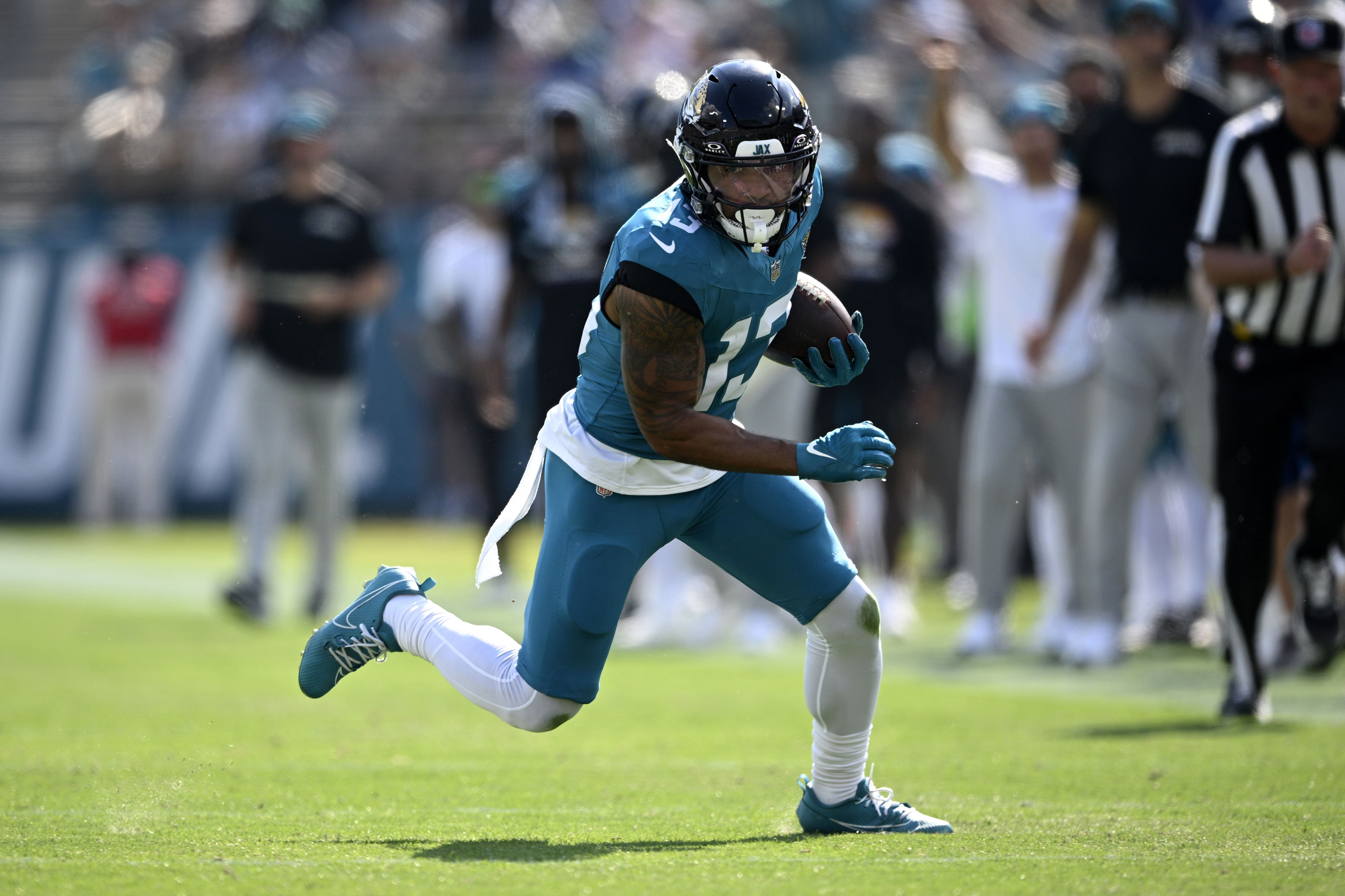 FILE - Jacksonville Jaguars wide receiver Christian Kirk runs after catching a pass against the Green Bay Packers during the second half of an NFL football game, Oct. 27, 2024, in Jacksonville, Fla. 