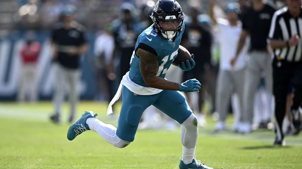 FILE - Jacksonville Jaguars wide receiver Christian Kirk runs after catching a pass against the Green Bay Packers during the second half of an NFL football game, Oct. 27, 2024, in Jacksonville, Fla.