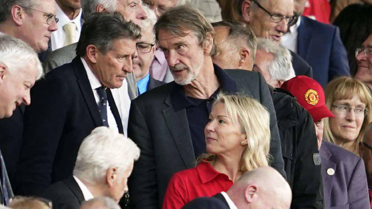 FILE - Jim Ratcliffe, center, in the stands during the English Premier League soccer match between Manchester United and Arsenal at the Old Trafford Stadium in Manchester, England, Sunday, May 12, 2024.