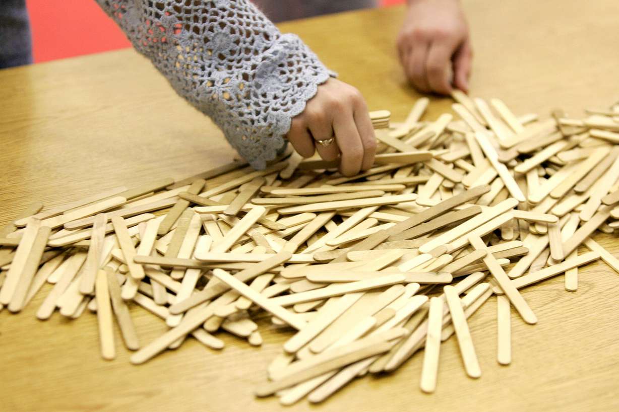 A student picks up a wooden stick during an exercise program called "Morning Mileage Club" at Ford Elementary School in Acworth, Ga., on March 10, 2006.