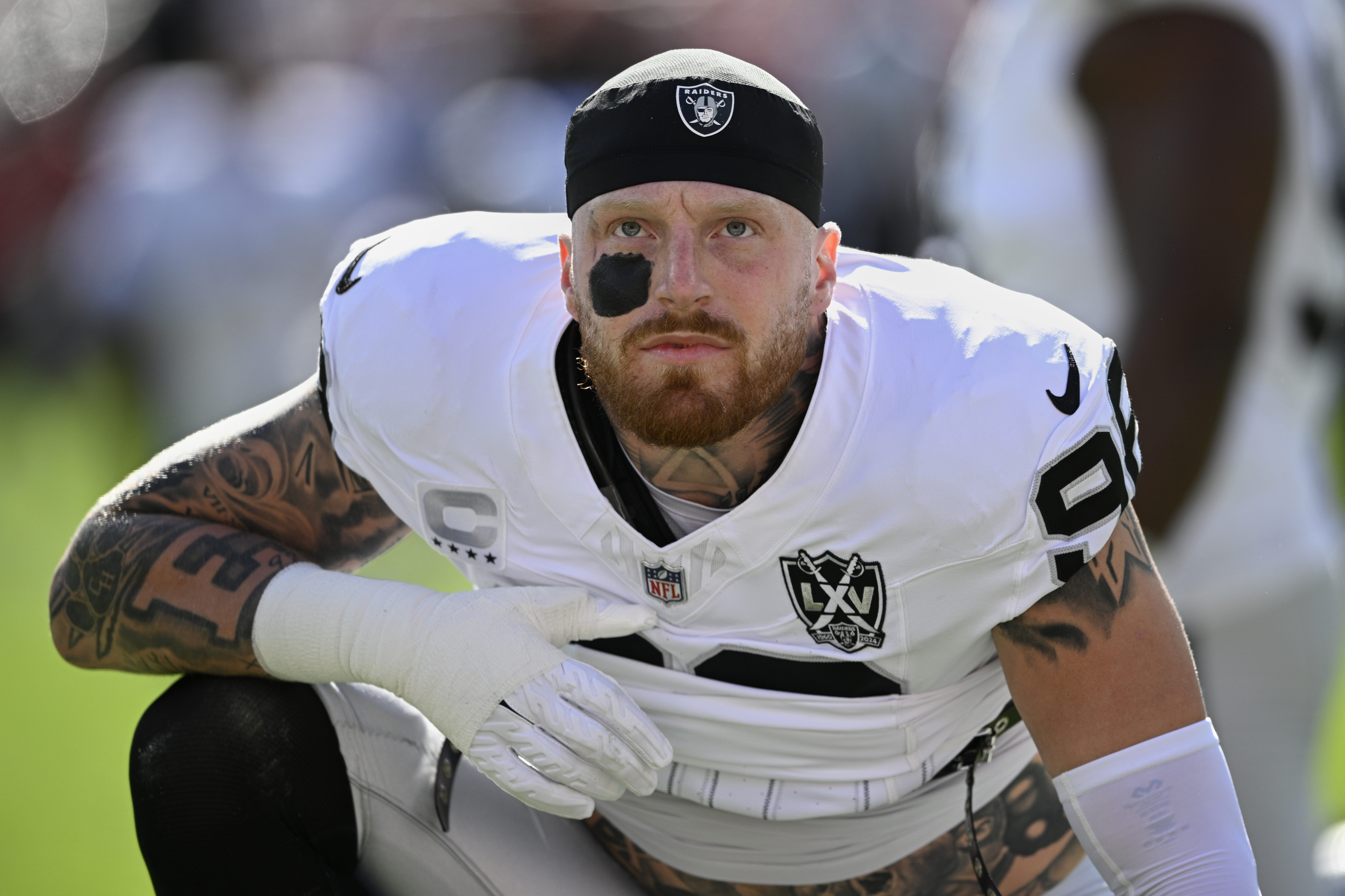 FILE - Las Vegas Raiders defensive end Maxx Crosby (98) warms up before an NFL football game against the Tampa Bay Buccaneers, Sunday, Dec. 8, 2024, in Tampa, Fla. 