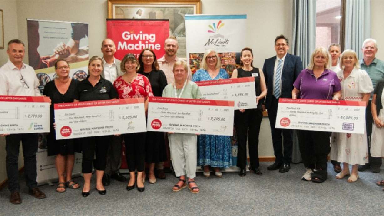 Local Light the World charity partners gather in Perth, Australia, to receive their Giving Machine donations in February.