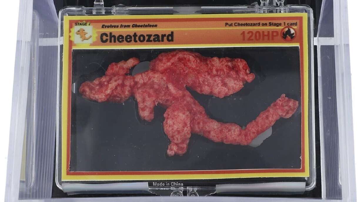 This undated photo provided by Goldin Auctions shows a Cheeto shaped like the Pokémon Charizard that has sold at auction for $87,840.
