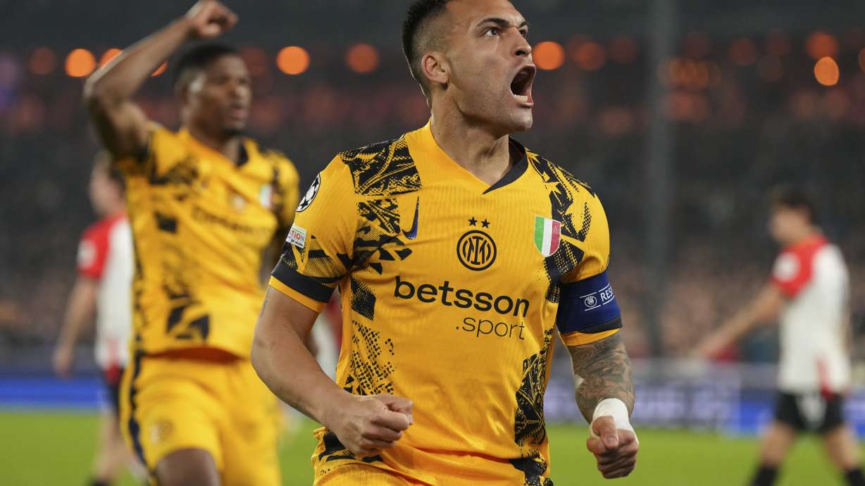 Inter Milan's Lautaro Martinez celebrates after scoring during the Champions League round of 16 first leg soccer match between Feyenoord and Inter Milan in Rotterdam, Netherlands, Wednesday, March 5, 2025.