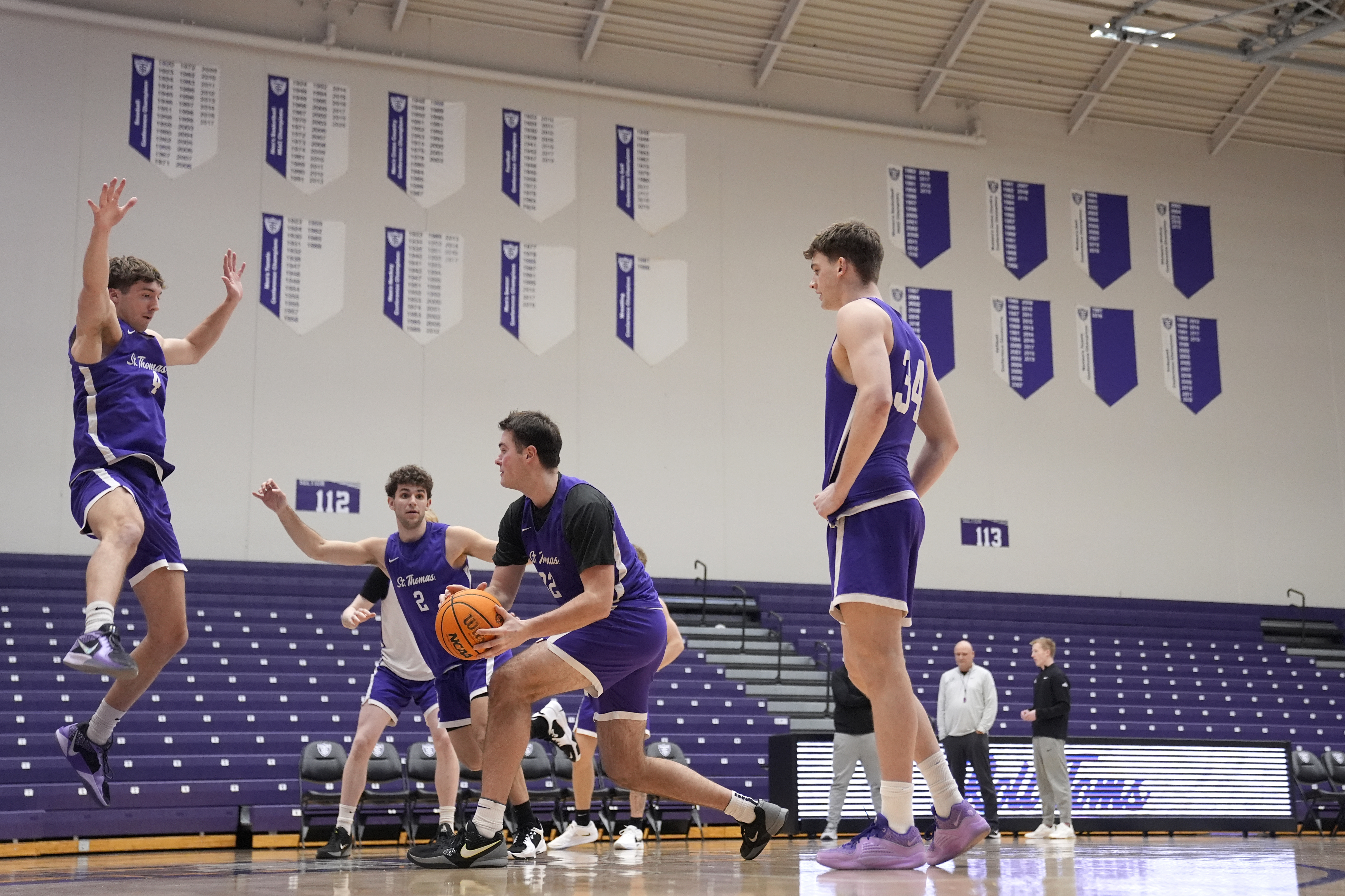 St. Thomas forward, Carter Bjerke, center left, takes part in drills during NCAA college basketball practice, Wednesday, Feb. 26, 2025, in St. Paul, Minn. 