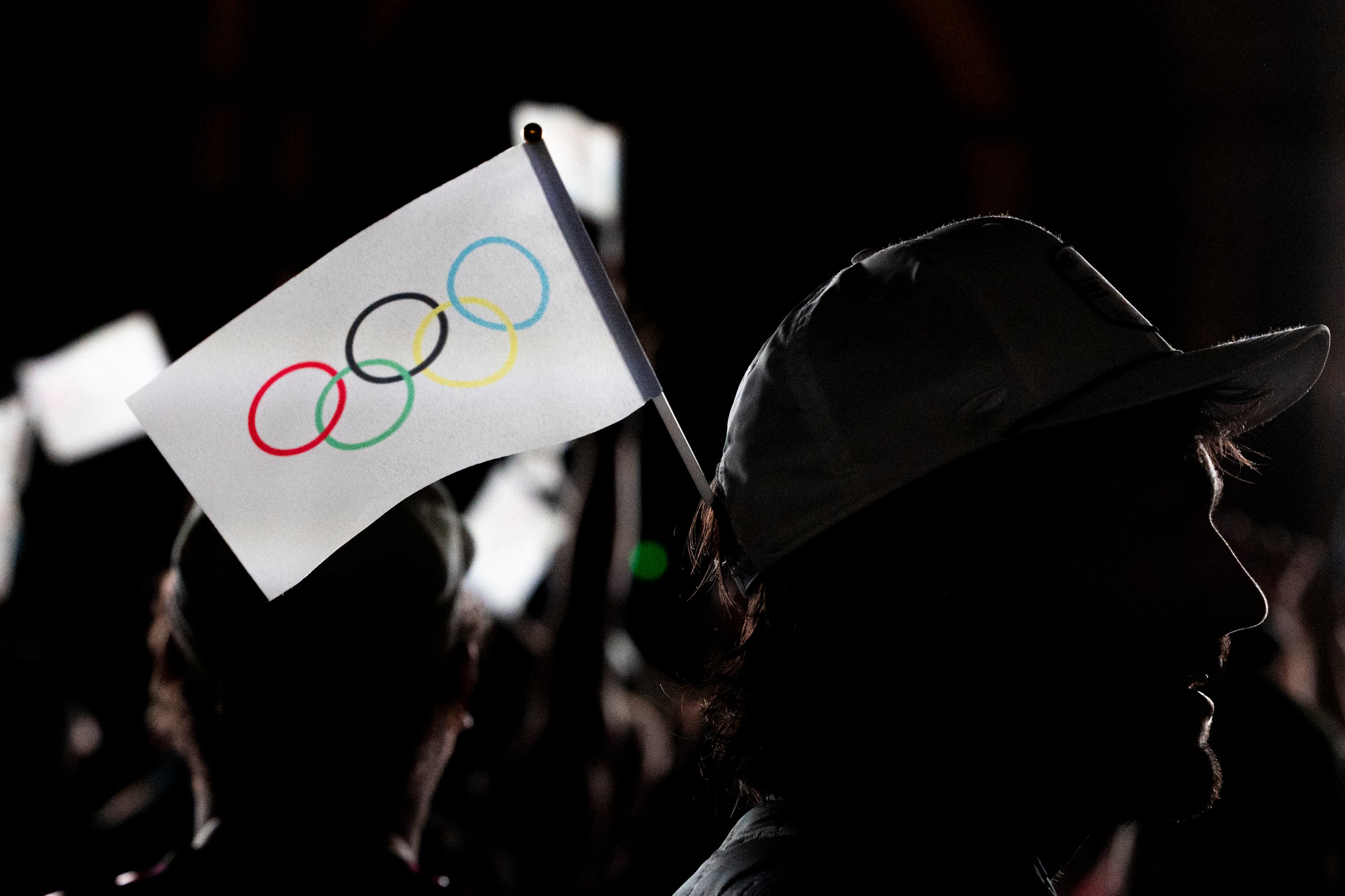 Jason D’Richards, of Salt Lake City, sports a flag in his hat during a live watch party for the Salt Lake City-Utah Committee’s 2034 Winter Olympics bid held at the Salt Lake City and County Building in Washington Square Park on July 24, 2024, in downtown Salt Lake City.