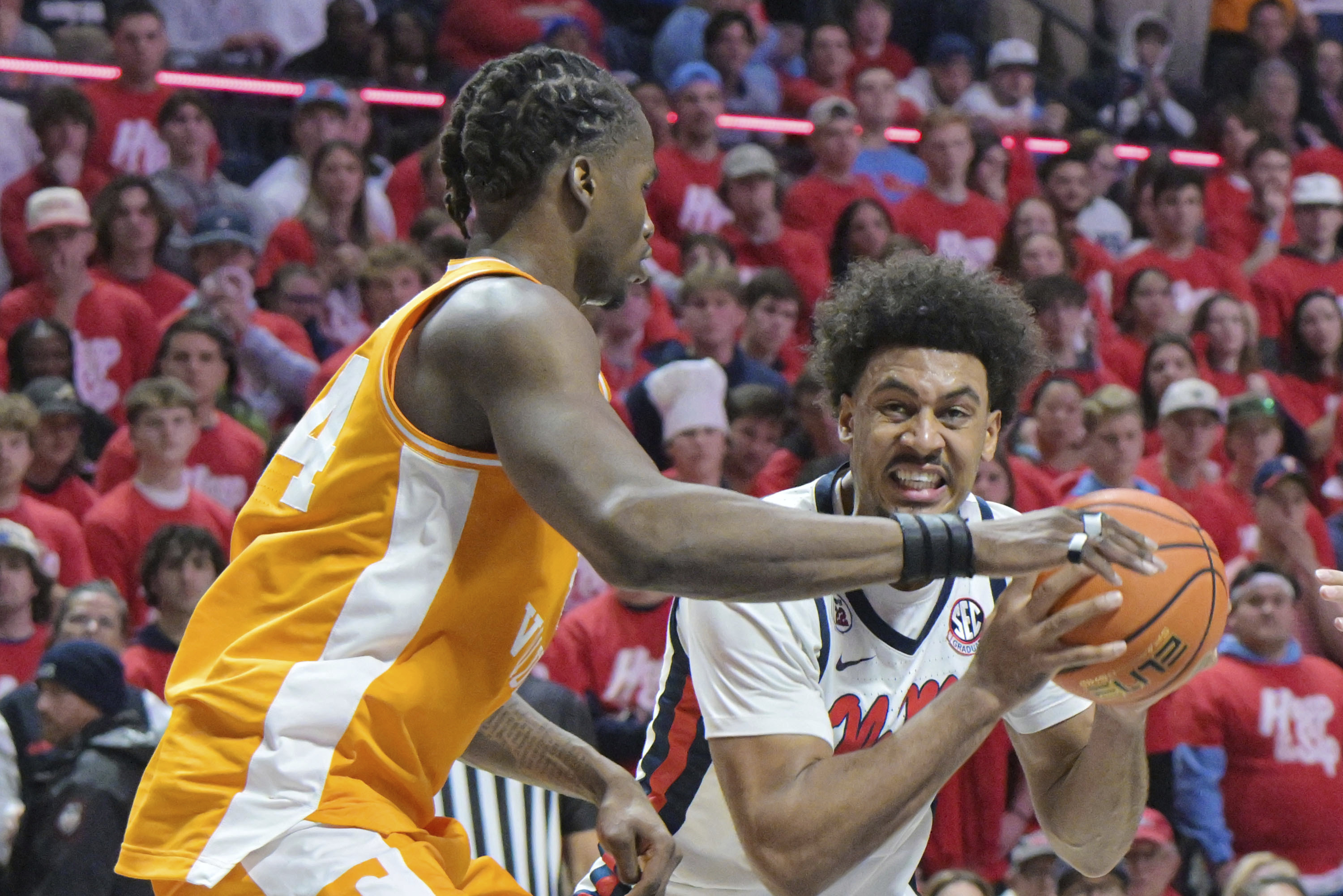 Mississippi forward Jaemyn Brakefield (4) is defended by Tennessee forward Felix Okpara (34) during the second half of an NCAA college basketball game in Oxford, Miss., Wednesday, March 5, 2025.