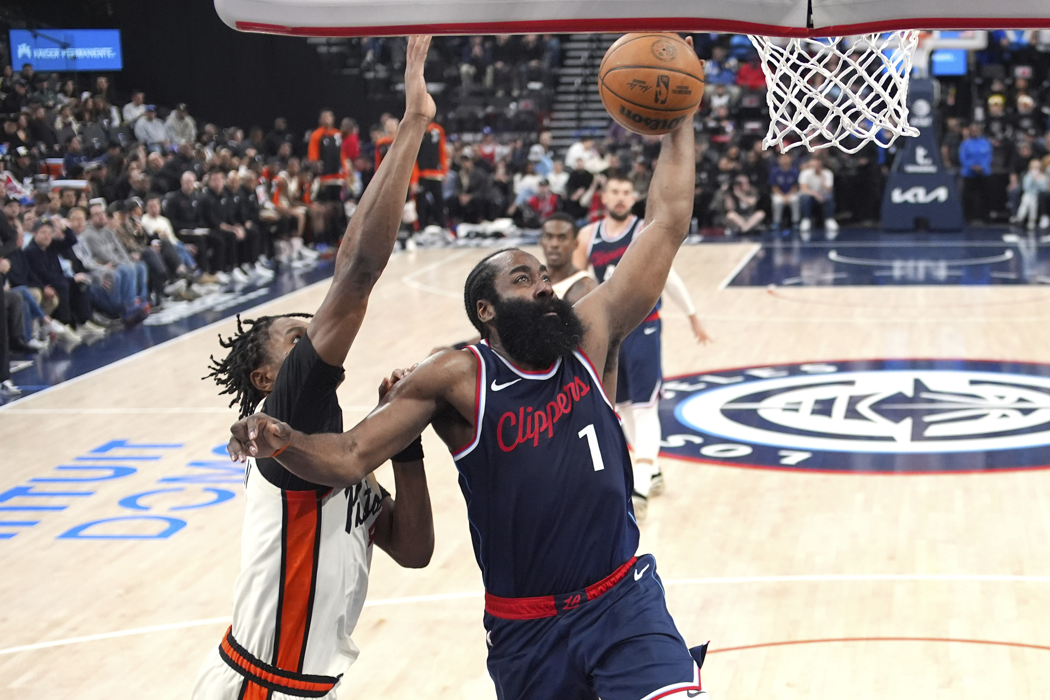 Los Angeles Clippers guard James Harden, right, shoots as Detroit Pistons forward Ausar Thompson defends during the first half of an NBA basketball game Wednesday, March 5, 2025, in Inglewood, Calif.
