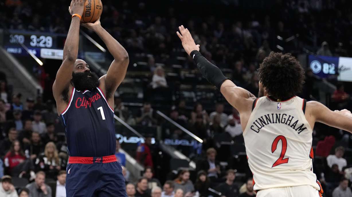 Los Angeles Clippers guard James Harden, left, shoots as Detroit Pistons guard Cade Cunningham defends during the second half of an NBA basketball game Wednesday, March 5, 2025, in Inglewood, Calif.